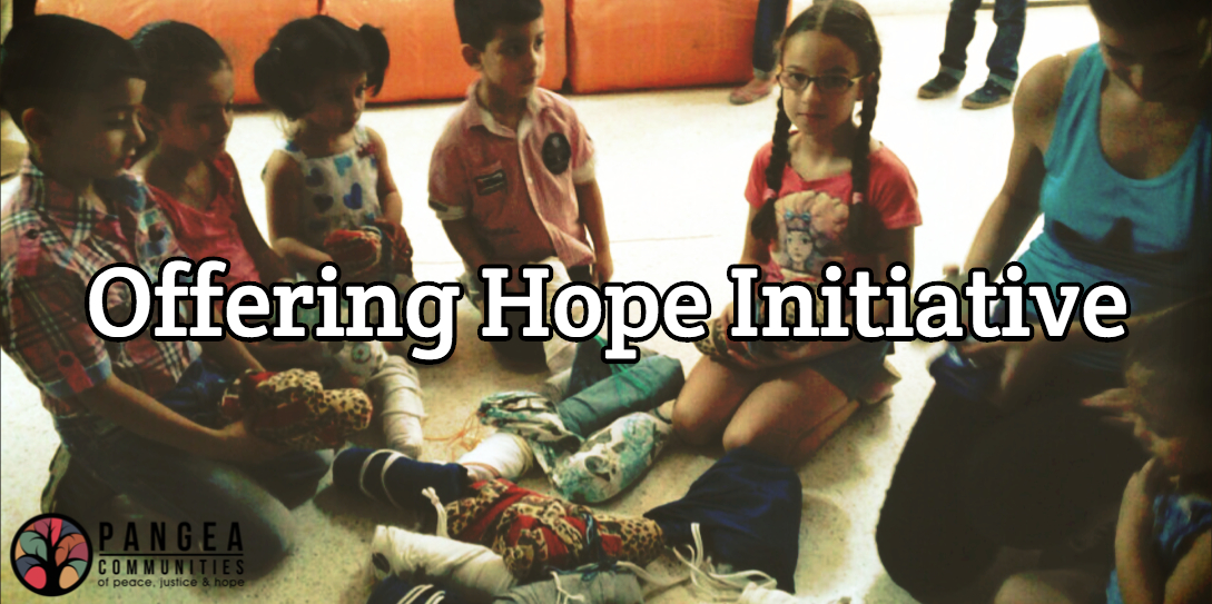 Syrian children – displaced from their homes because of the war – receive school kits with school supplies from MCC.