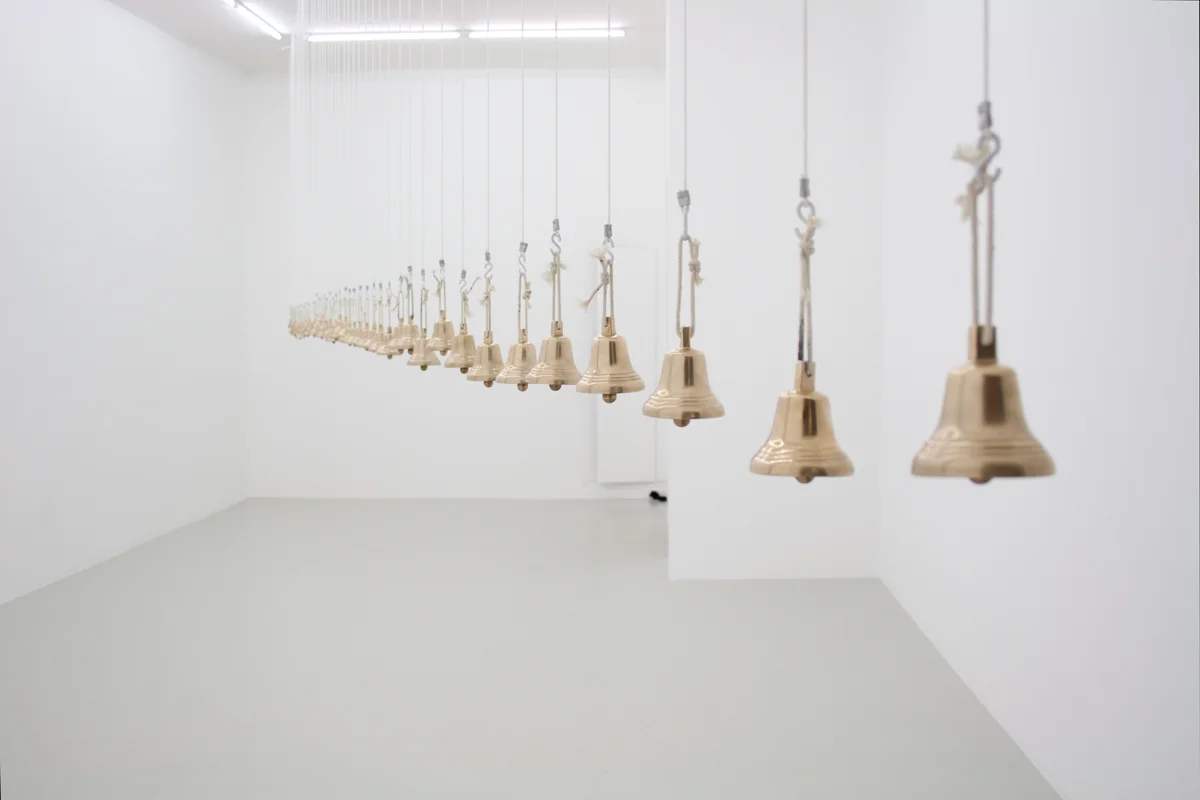 David Horvitz, Let Us Keep Our Own Noon, 2013 Installation of 47 bronze bells made from the metal of a melted French bell dated from 1742, turnings, slag, and a weekly performance for 47 performers every Saturday at local noon. Dimensions variable (currently 200 x 860 x 5 cm).