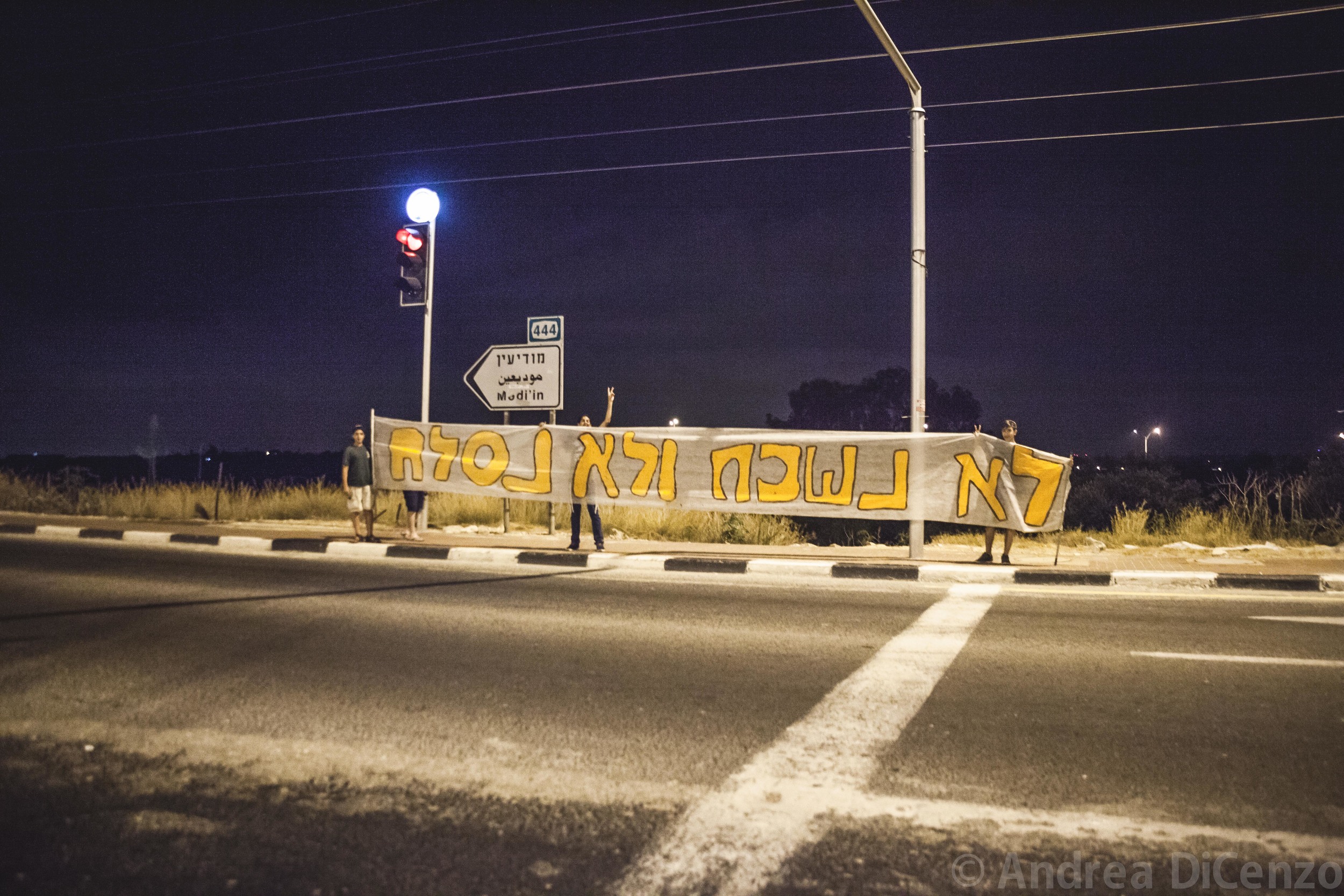  " We won't forget and we won't forgive": reads a homemade banner on the evening of the discovery of the bodies of the three missing teenage Israeli boys.&nbsp;  