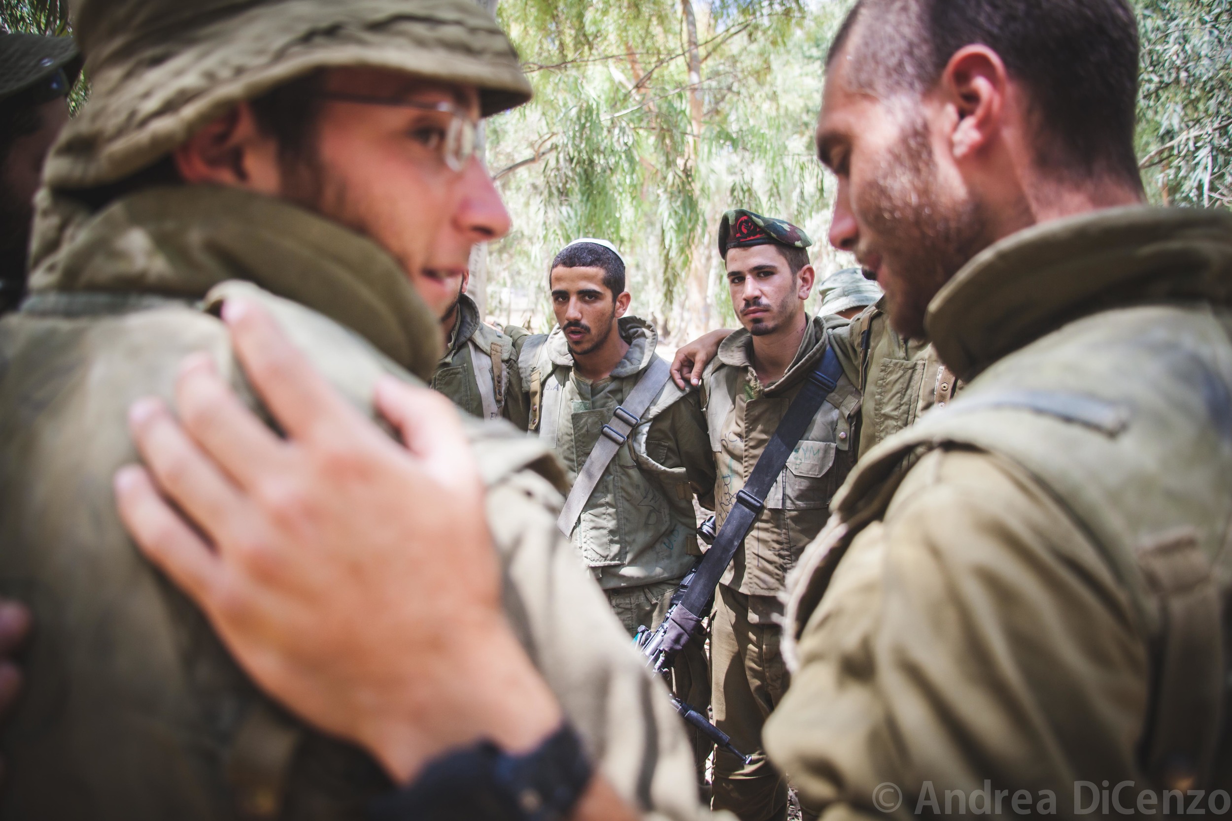  IDF soldiers chant songs and prayers as they await further instructions along the border of Gaza. These men are part of an additional 18,000 soldiers that have been called up to the border as part of Operation Protective Edge.&nbsp; 