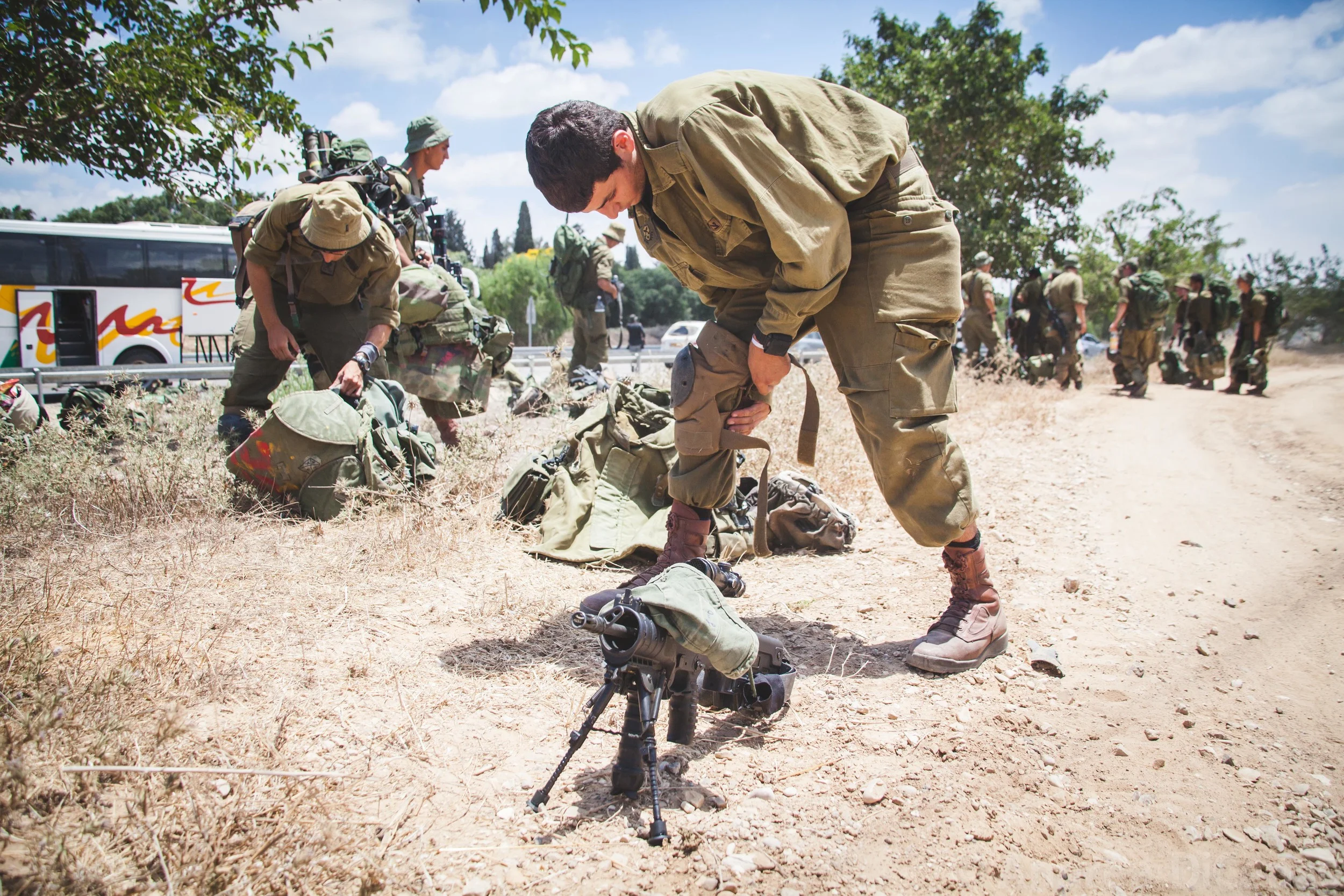 Buses of Israeli Defense Forces alight on the Israel/Gaza as the ground incursion phase of Operation Protective Edge begins. 