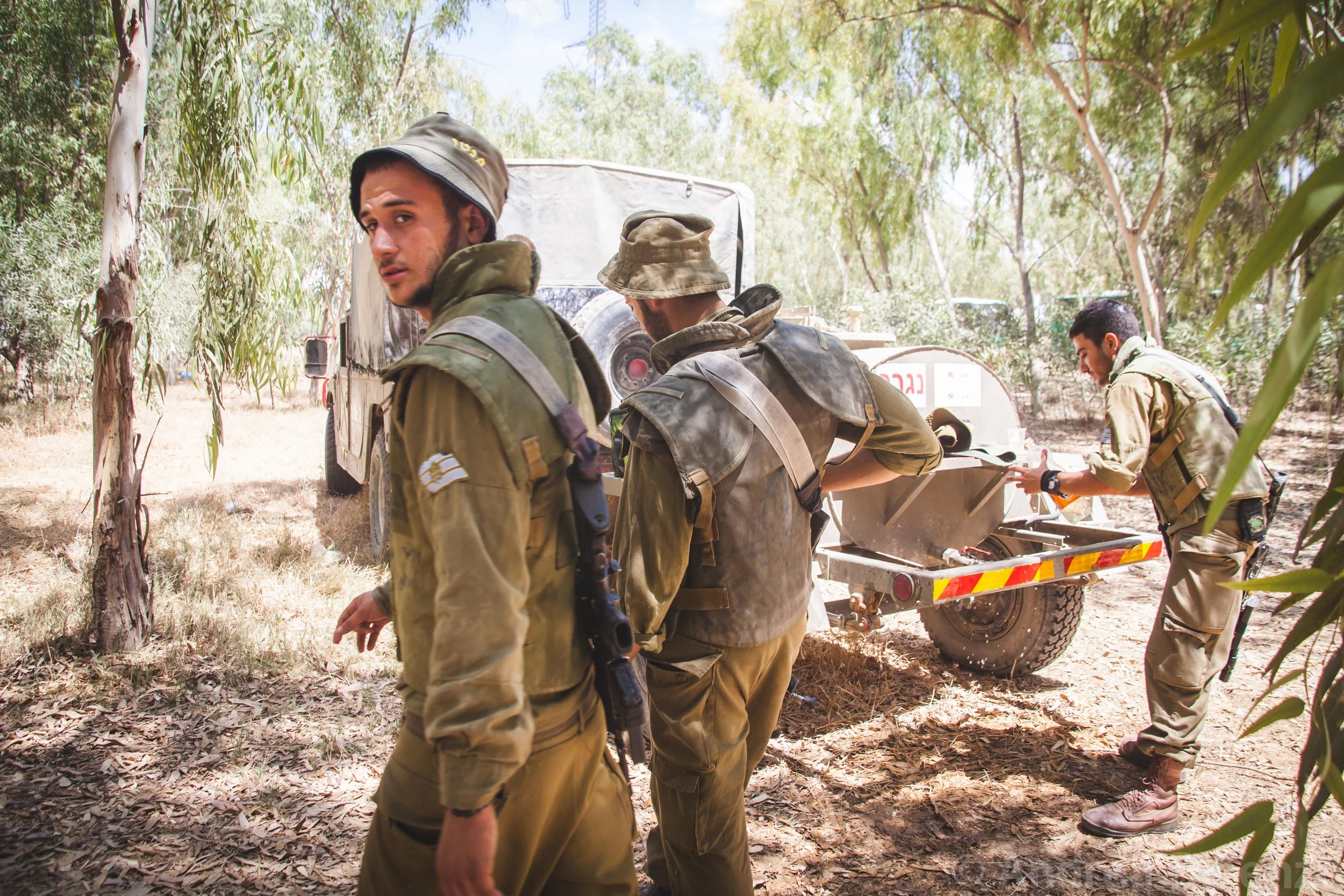 Motor rockets can be heard going off as close as 500 meters away as the soldiers gather to receive further command as the ground incursion begins as part of Operation Protective Edge. 