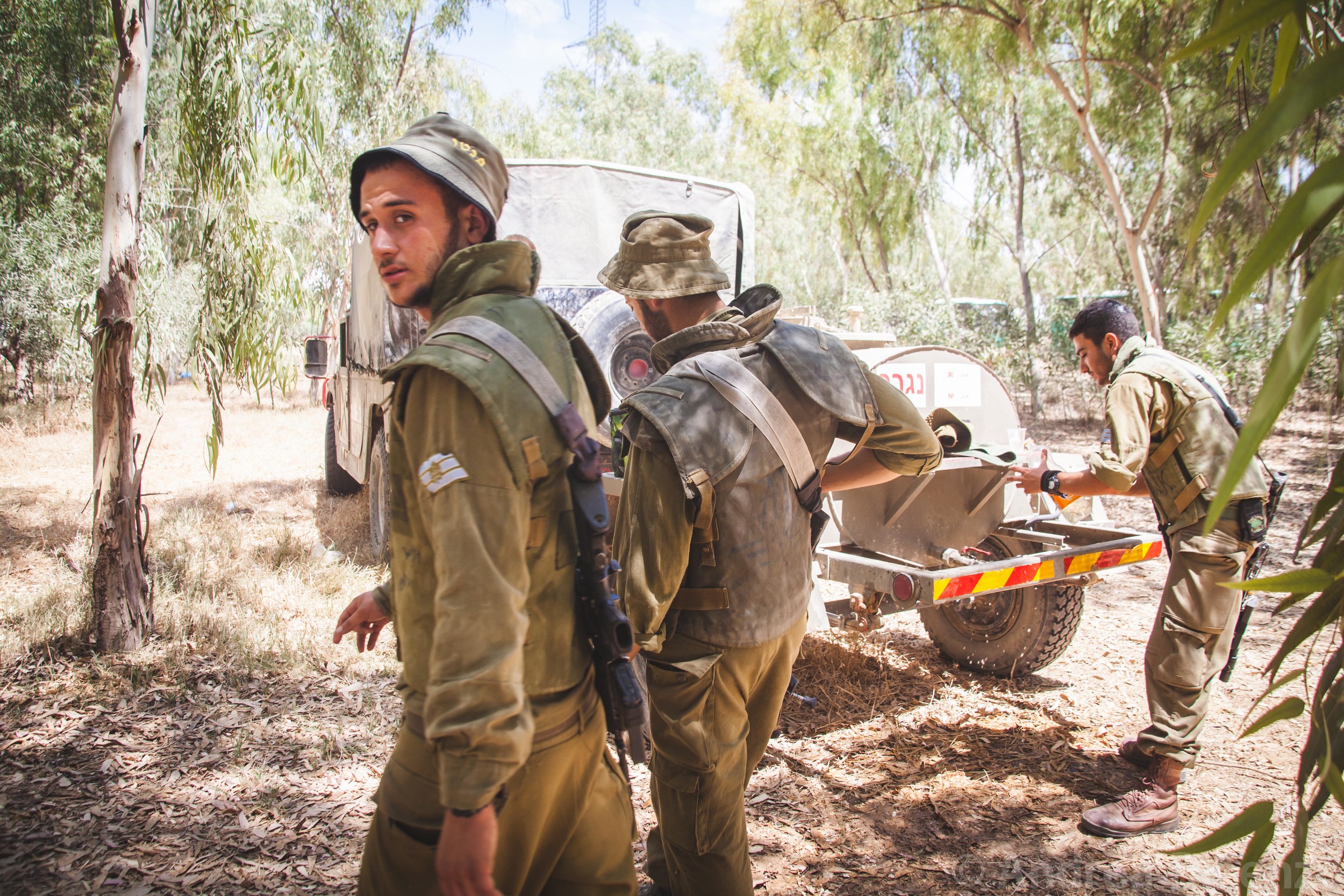  Motor rockets can be heard going off as close as 500 meters away as the soldiers gather to receive further command as the ground incursion begins as part of Operation Protective Edge.&nbsp; 