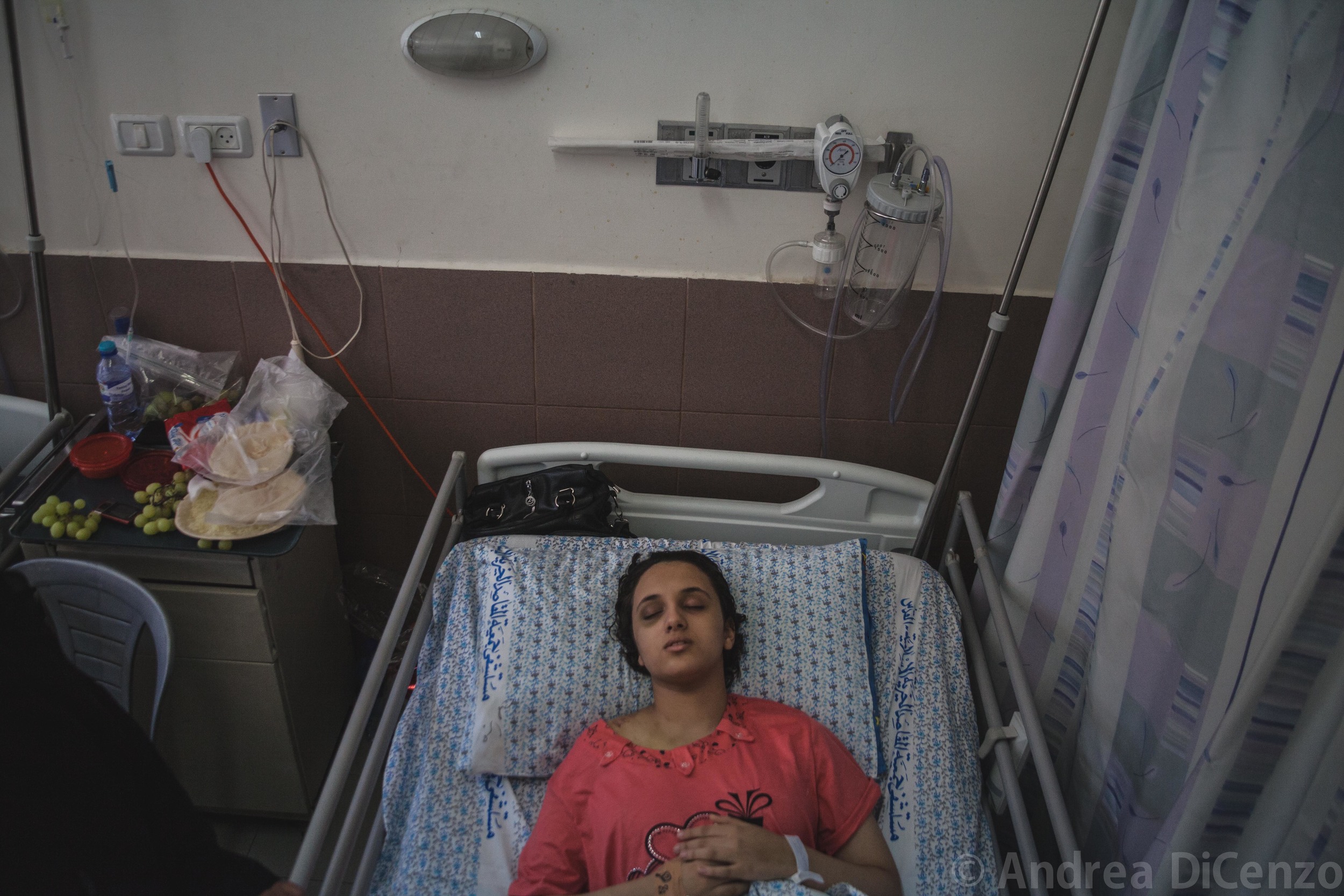  Ahad, 14, is coming out of a coma in Al-MaKassed Hospital in East Jerusalem. She is unaware that her parents didn't survive the attack. 