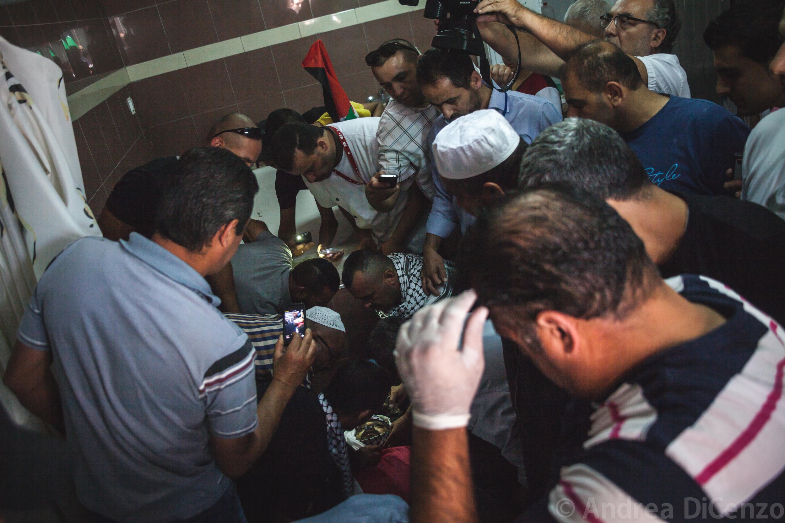  Mohammad is prepared for his funeral precession in Al MaKassed Hospital, East Jerusalem&nbsp;before his body is transported back to Gaza for burial. The Gazan came in at 3am but did not make it through the night.&nbsp; 