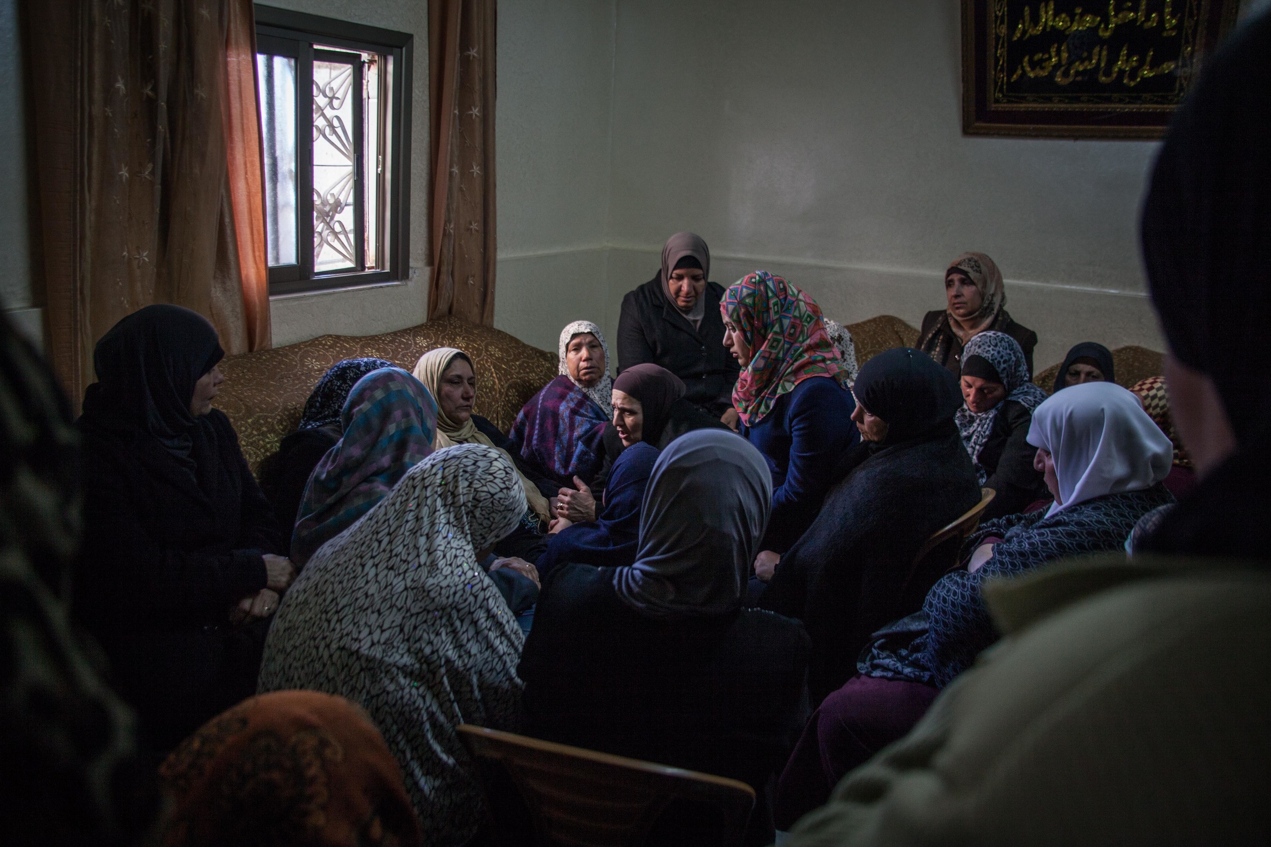  Family and community members mourn the death of Mahmoud Abdullah Adwan, 21, who was shot and killed in the morning by Israeli Defense Forces in Qalandia Refugee camp, West Bank. 