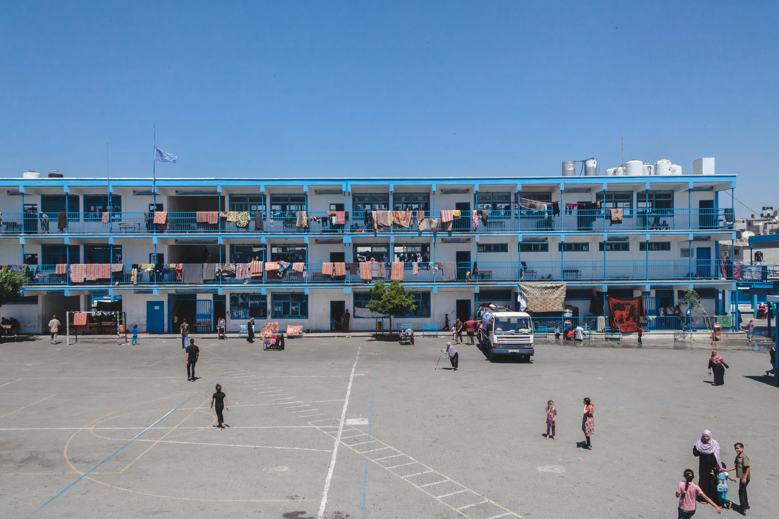 Families hang their washing from Fakhoora UN School, one of the UN school which has become a temporary shelter for the some 65,700 internally displaced people that have fled their homes.