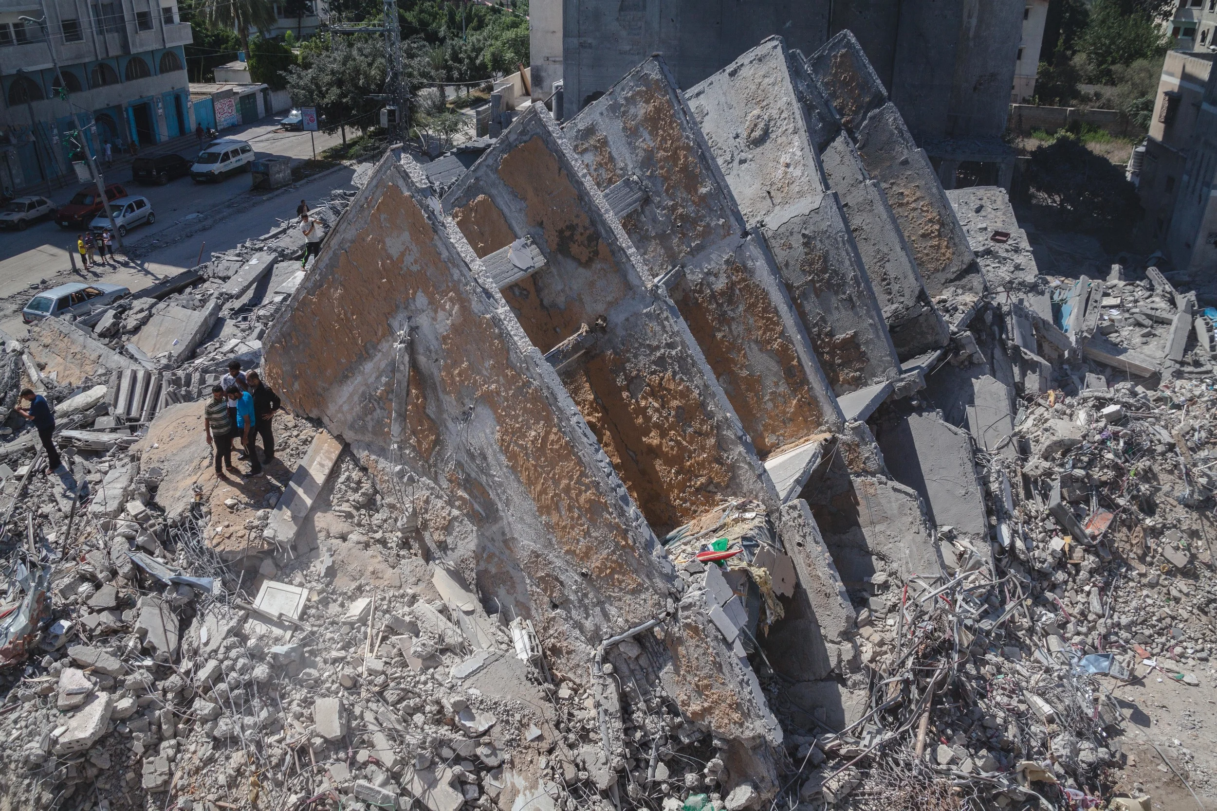 The remains of Al-Basha tower in the center of Gaza City after it collapsed following an airstrike by Israel fighter planes. Residence of the 15 story residential building successfully evacuated after receiving warnings from the IDF of impending strike.