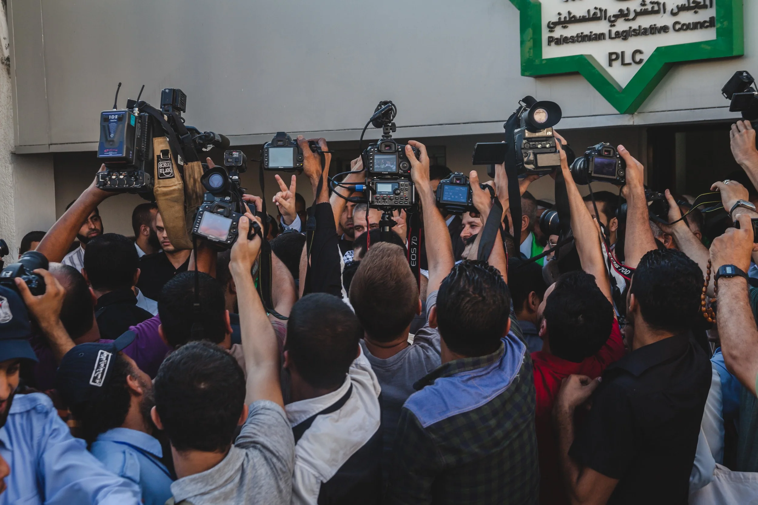 Photographers crowd Senior Hamas leader Ismail Haniyah, in his first public appearance since the war began in Gaza City.