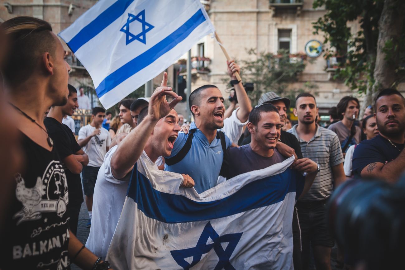  Extreme right protestors yell chants and sing song over peace-protestors in Jerusalem's Zion Square. Since the boy's went missing in the beginning of June, these right wing protestors have taken to the streets weekly to spread their message, as well