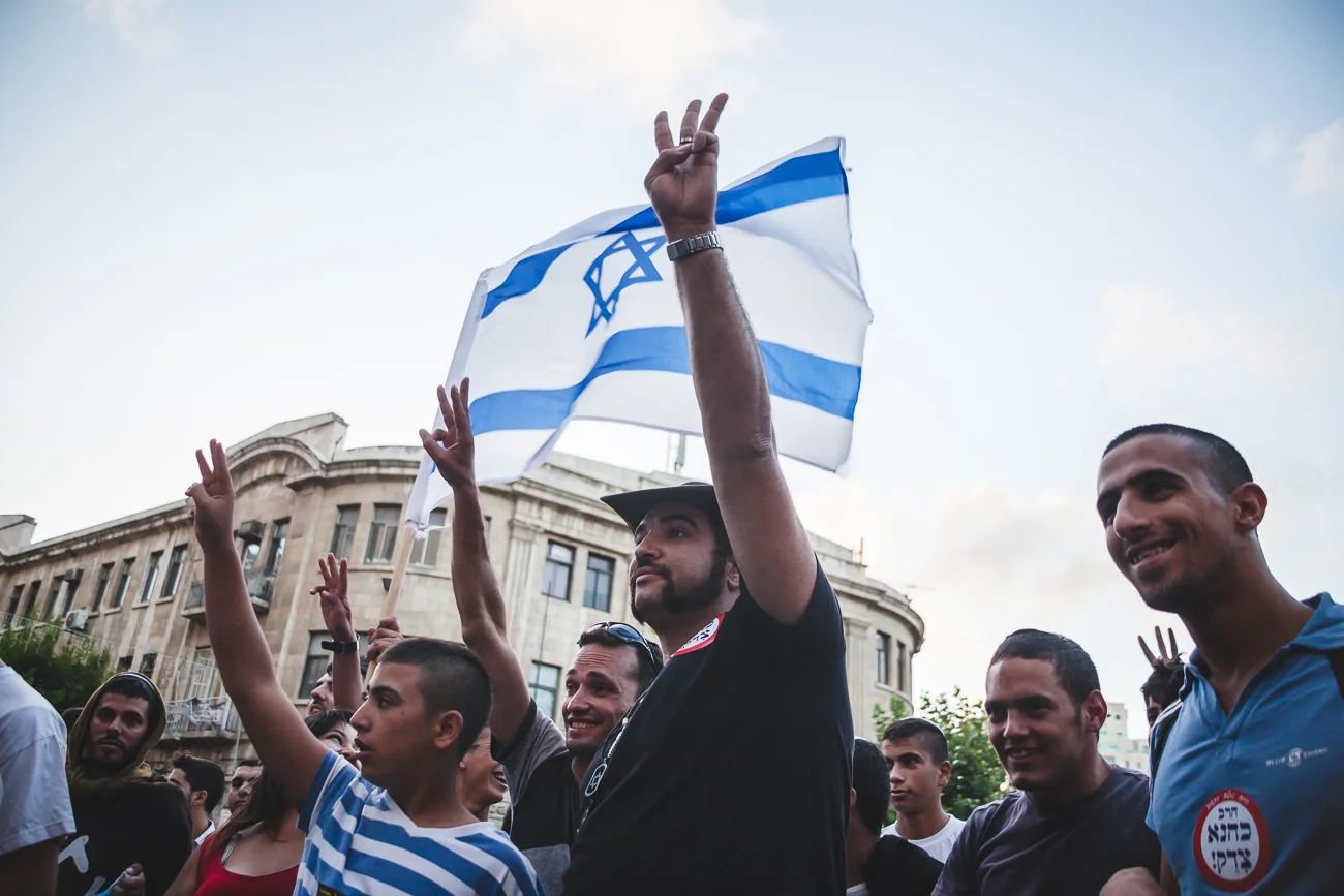 Right-wing protestors taunt peace activists at a rally in Zion Square, Jerusalem, during Operation Protective Edge. Right-wing protestors take to the streets weekly to hand out leaflets highlighting their objectives and harassing Arab citizens and workers. 