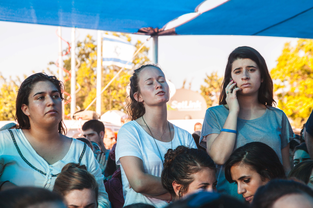  Three girls mourn for the death of their fellow countrymen at the state funeral of Naftali Fraenkel, Yaakov Naftali, and Eyal Yifrah. 