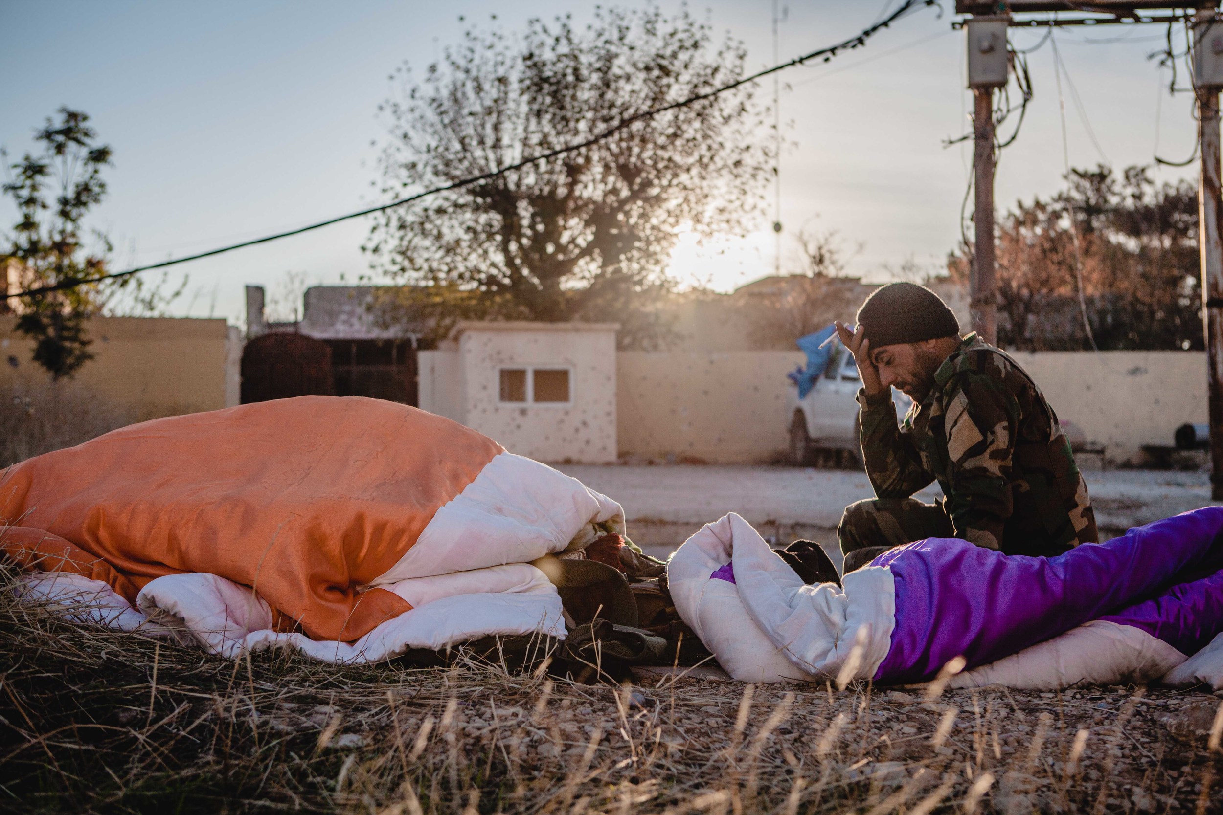 Peshmerga soldiers wake up in the morning after the two battle with ISIS militants to take back the city of Sinjar.