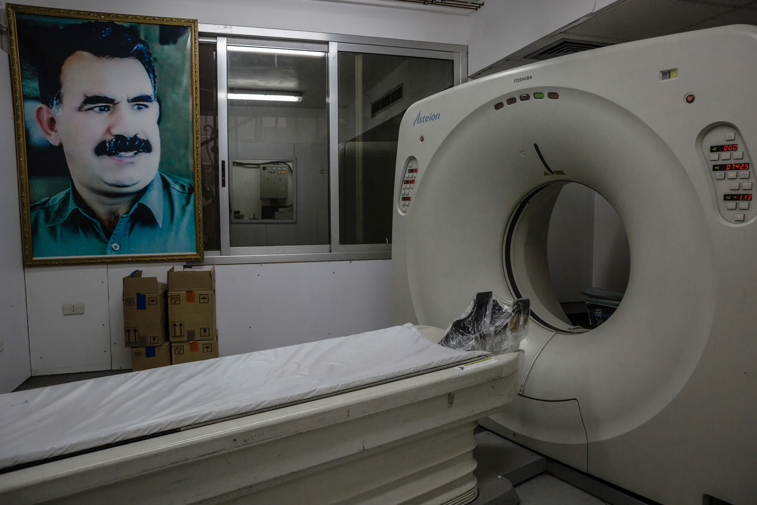 A new CT scanner at Martyr Xebat Hospital in Qamishli, the most advanced hospital in the Kurdish held area of Syria. The medical device took sixteen months of negotiations to travel from Japan to northern Syria. Because of the war, there is limited access into northern Syria and securing permission for medical equipment is difficult.