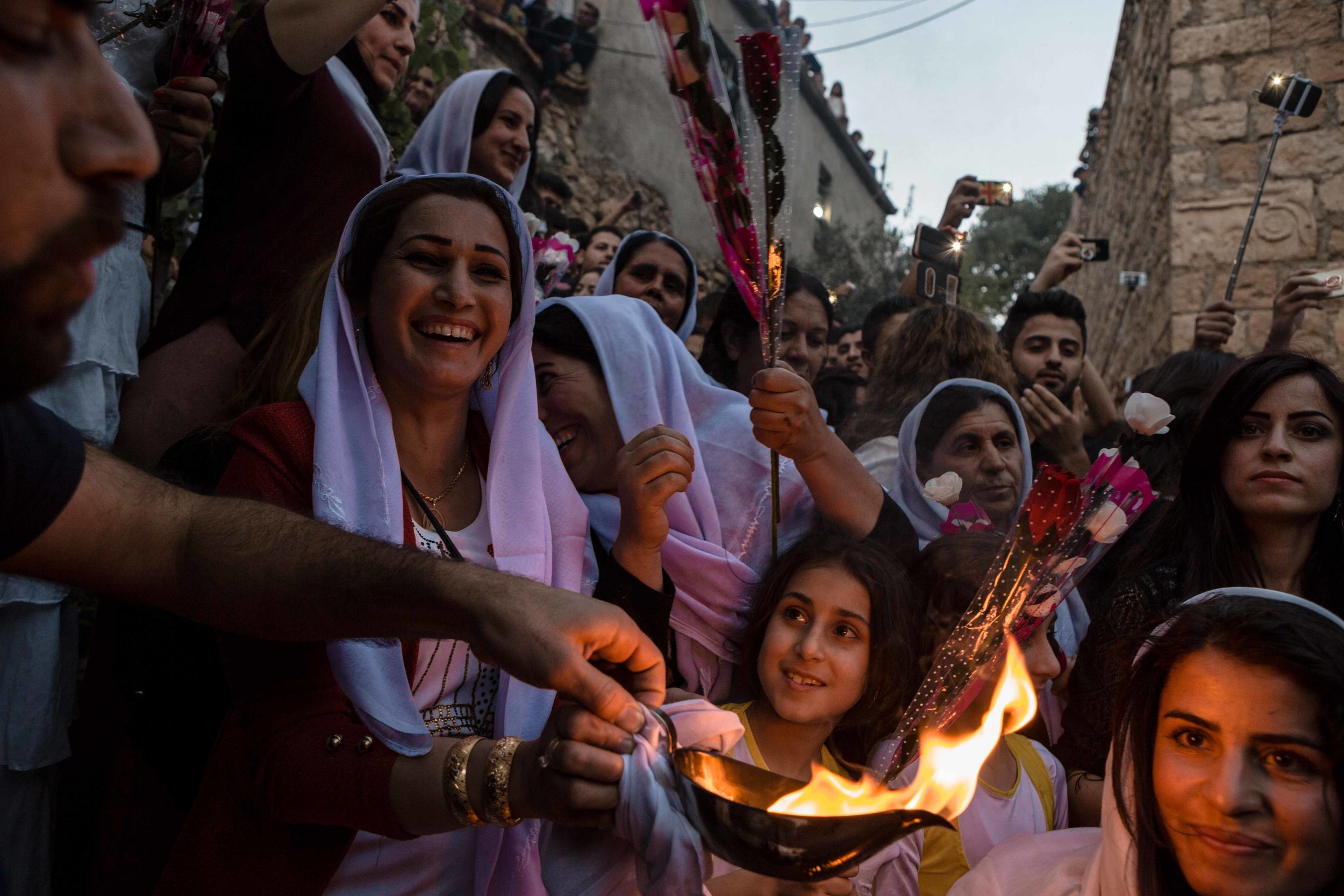  Thousands of Yazidis gather at the religions holy temple of Lalish for the lighting of the candle celebration for Yazidi new year. 