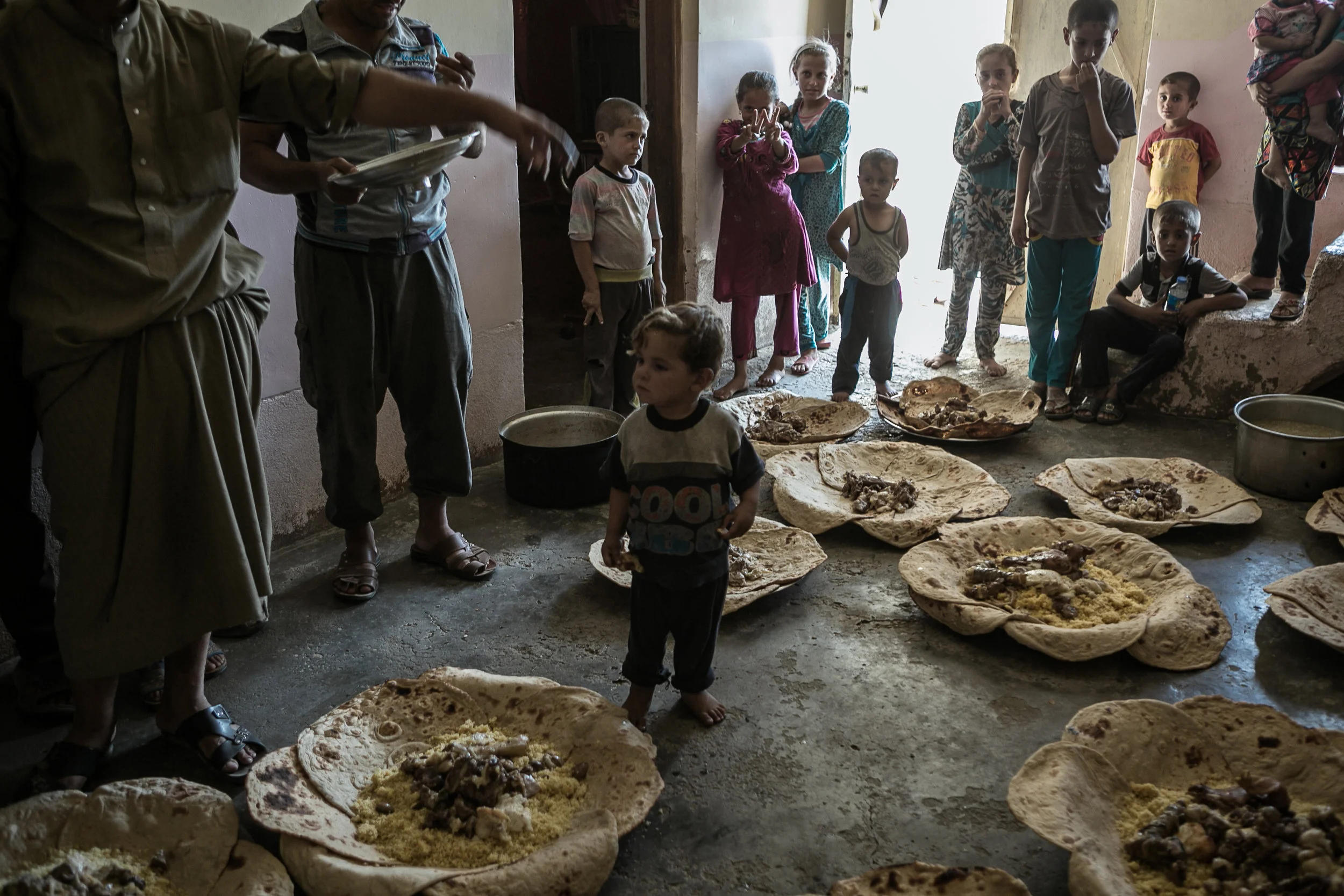 Villagers prepare a lunch for the soldiers of the Iraqi army after their town was liberated from the Islamic State, Nineveh province, south of Mosul. 