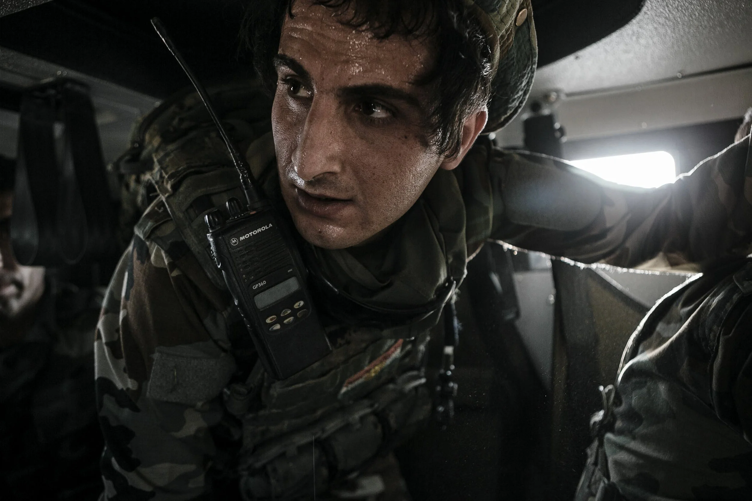 Sweat drips off an Iraqi Peshmerga fighter due to the sweltering heat inside an armored vehicle during a mid-summer battle in northern Iraq. The Peshmerga have been responsible for much of the ‘shaping operation’ that laid the ground work for the Iraqi Army offensive on Mosul from the east later in the year. In 2015, the Peshmerga took a sizable amount of territory back from the hardline Sunni militants.