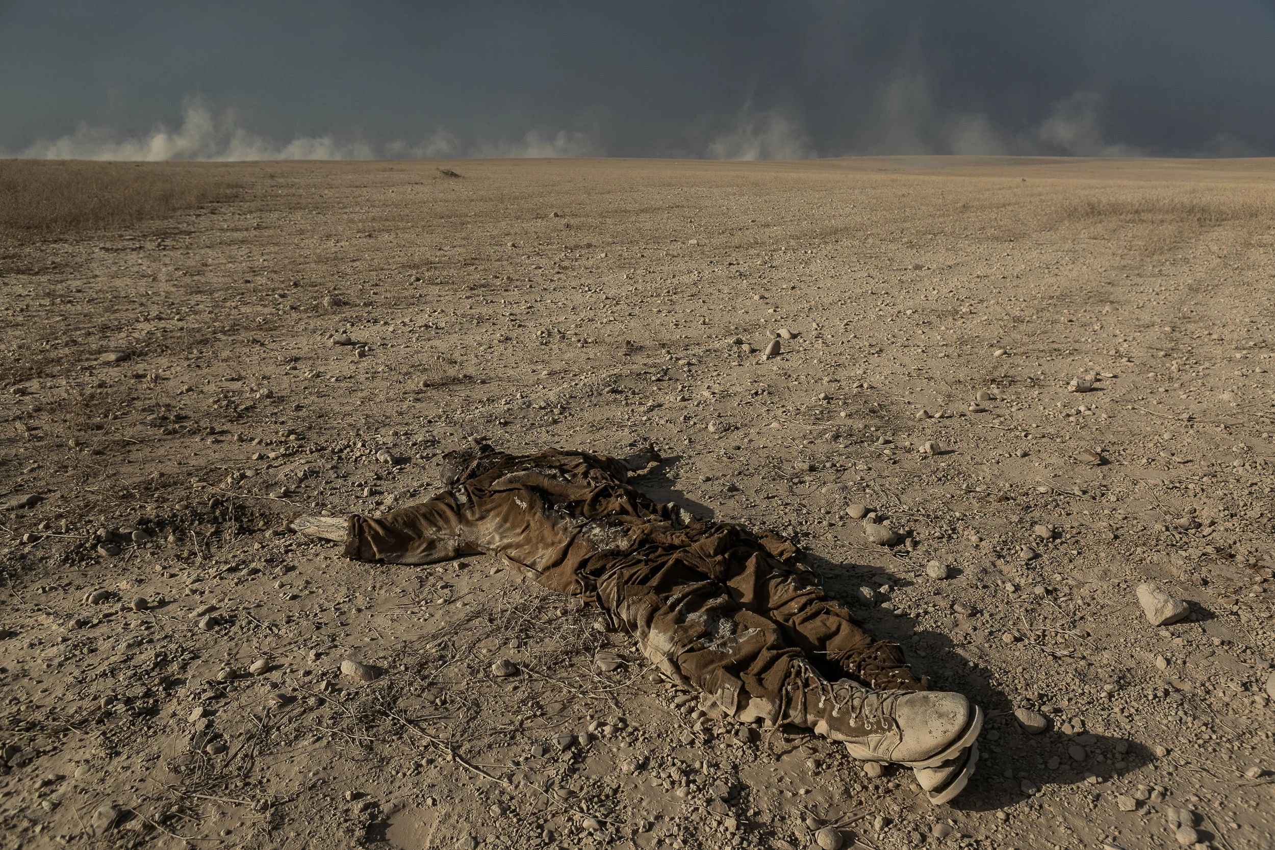 A headless, handless body of an Islamic State fighter abandoned in the middle of the desert of the Nineveh plains.