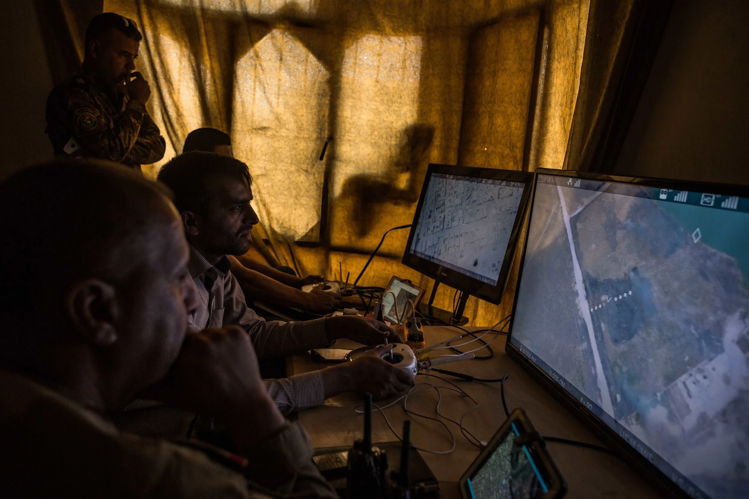 Members of the Iraqi army’s 9th division watch the movements of Islamic State militants through live drone footage along the northern frontline in western Mosul. More than two dozen militants can be seen walking the grounds of the last remaining medical complex under their control. Iraqi forces believe the medical complex is being used as a de-facto military headquarters for ISIS. They also have intelligence that civilians are inside, making the operation to take the complex more difficult for the advancing forces. It will take over a month for the forces to ultimately reclaim the hospital. Once they do, it is completely destroyed. 