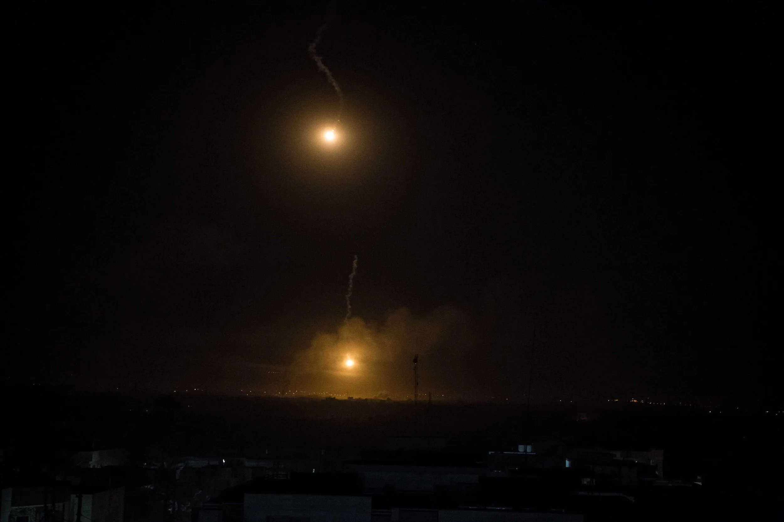 Flares illuminate Islamic State positions over the Old City neighborhood of Mosul as Iraqi forces prepare for another morning offensive. 