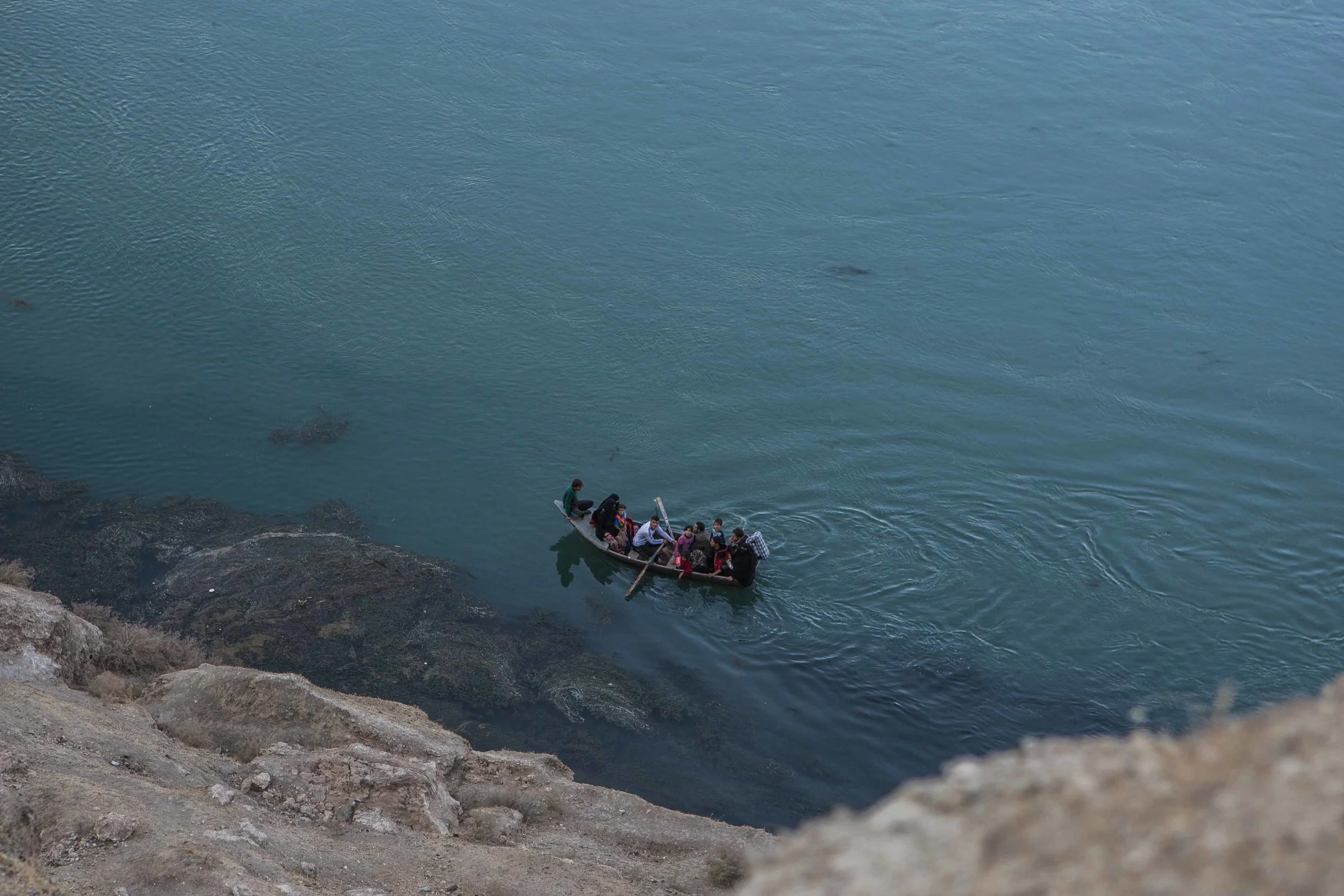 Iraqis flee from an Islamic State held village across the Tigris to an Iraqi army controlled village on the other side. The Iraqi army has made slow but sustained progress moving north through the Nineveh Plains to reach Mosul from the south as elite counter-terrorism forces push into the edges of Mosul from the east. October 29, 2016.