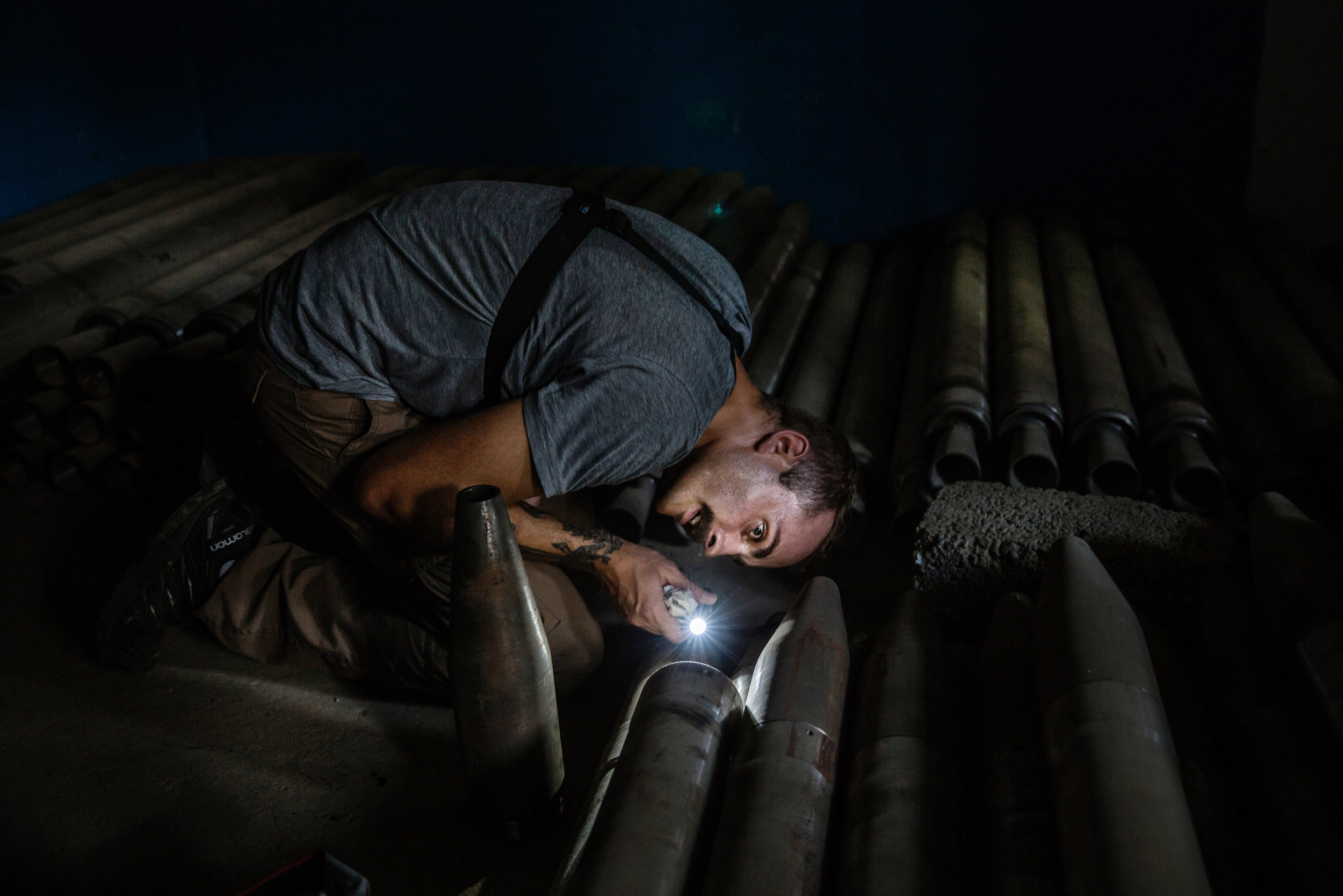 Weapons investigator Damien Spleeters of the organization Conflict Arms Research examines the inside of one of the many Islamic State-manufactured rockets found inside a family home-turned-weapons-warehouse in Tal Afar, northern Iraq. ISIS’ network