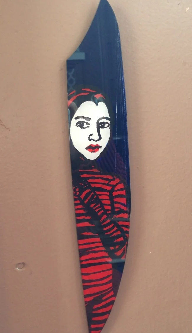  This is very small, about 1 - 1.5&nbsp;inches wide and 6 - 7&nbsp;inches tall. It's a clear shard of acrylic with paint applied in layers to the back. 