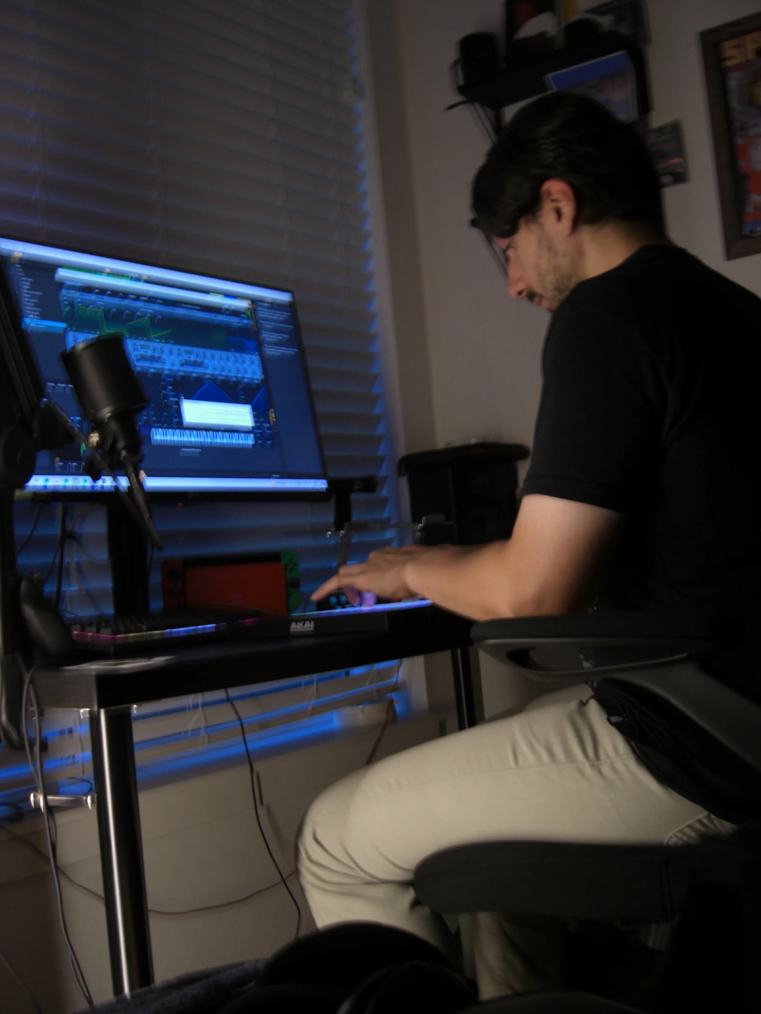 ElCrow working in a blue-lit recording studio