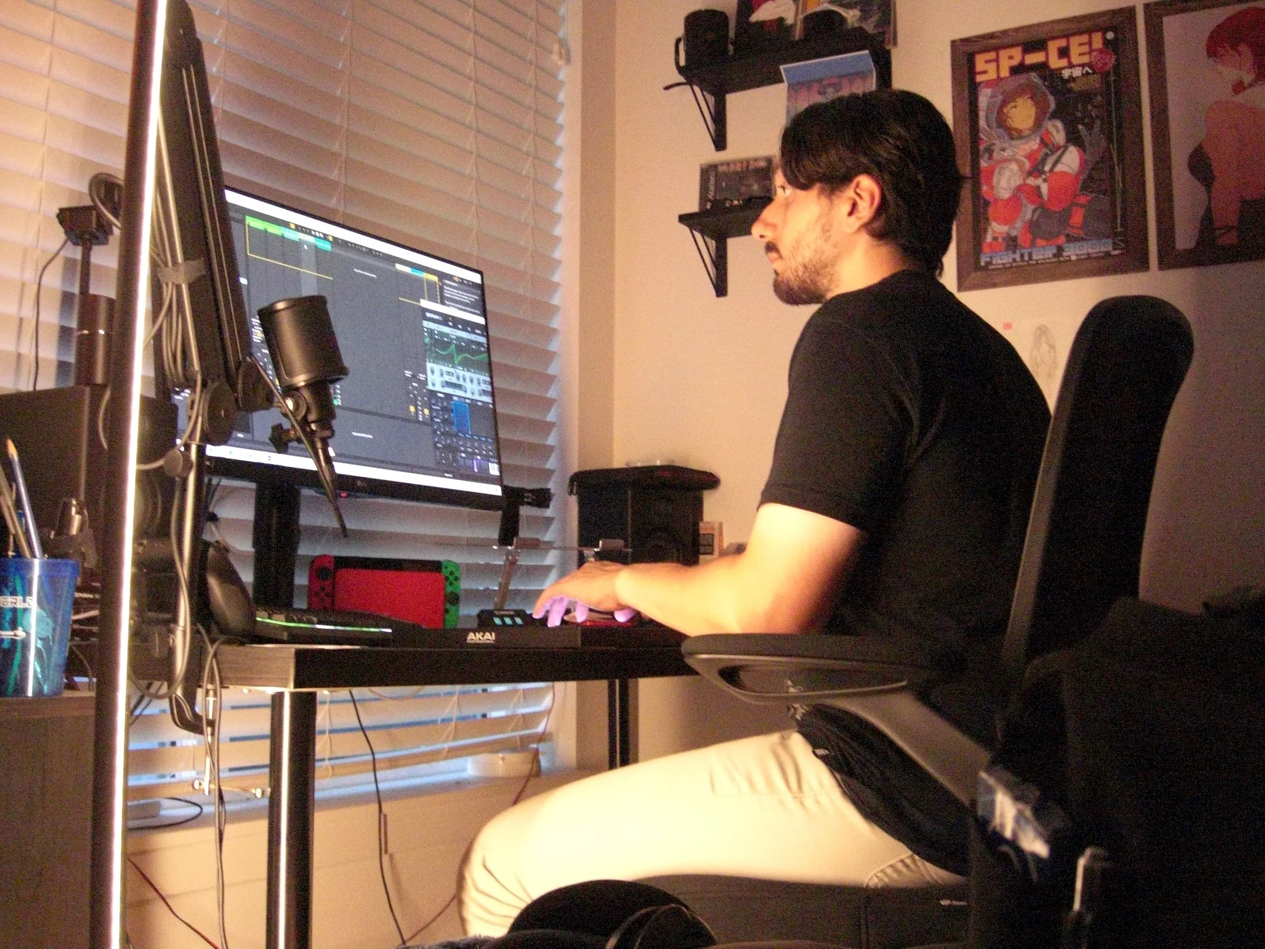 ElCrow producing beats on a studio keyboard