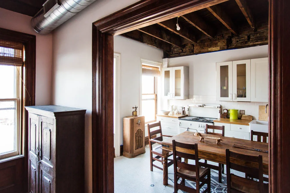 A view of the kitchen in the Bowler, complete with a vintage 1910 Champion stove and vintage Kelvinator refrigerator.