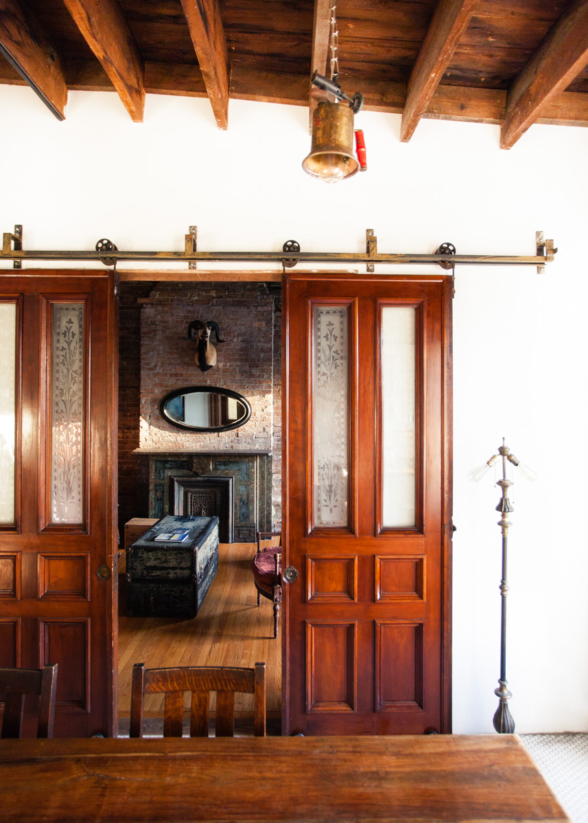 The building's original mahogany doors have been repurposed as sliding barn-style doors.
