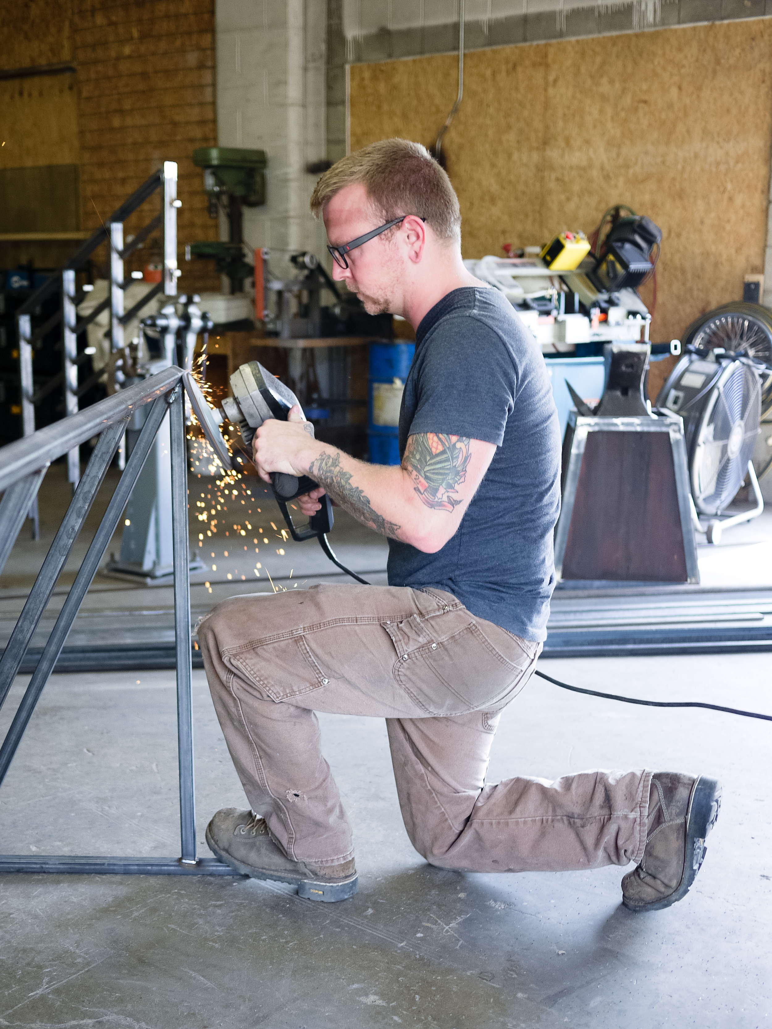 Josh works on a bike rack.
