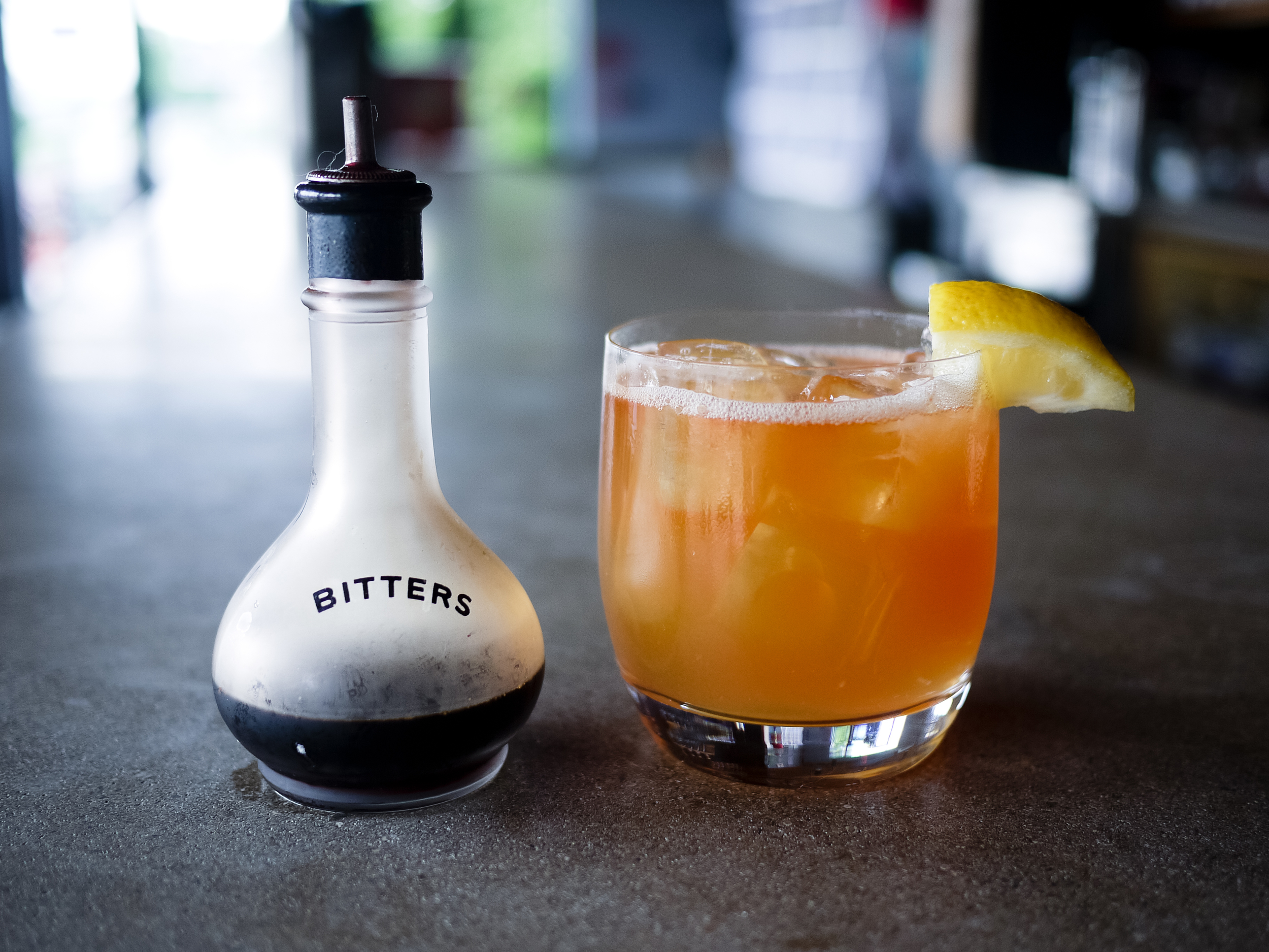 House-made aromatic bitters and a Cardinal Sling cocktail. 