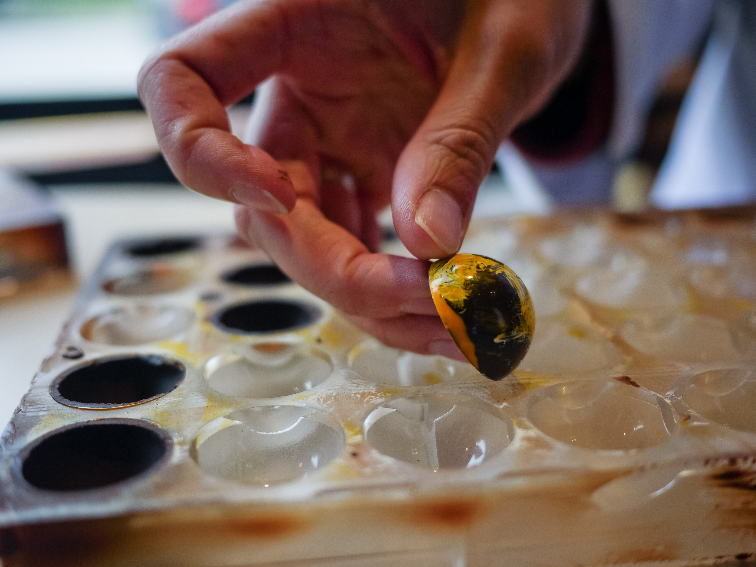 Hand-painted chocolate shells, ready to be filled with ganache.