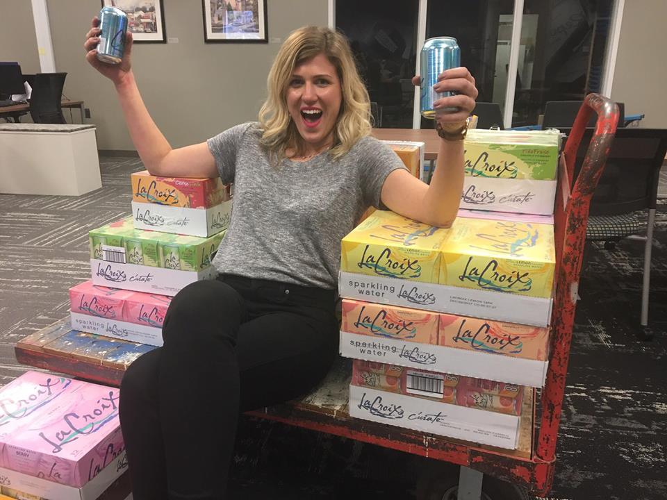 Claire with her first of four shipments of La Croix. This one arrived at her office, much to the delight and confusion of her co-workers.