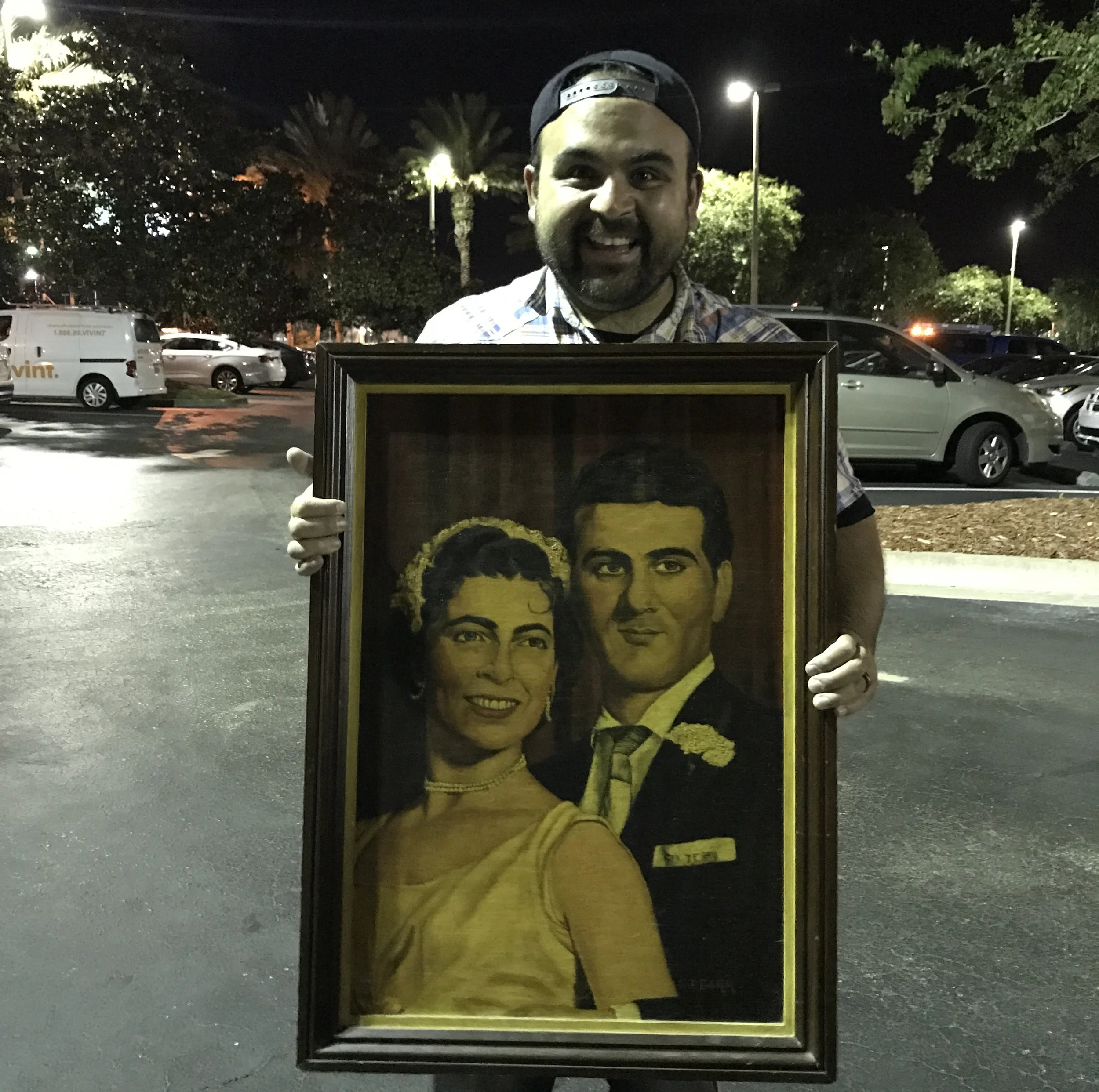 This is a portrait painting of Jason's grandparents on their wedding day. It's definitely sentimental, and also definitely huge.
