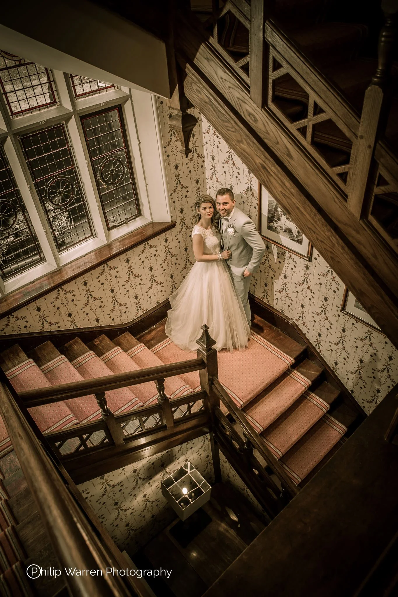 Bride and Groom on Stairs at Coed-y-Mwstwr