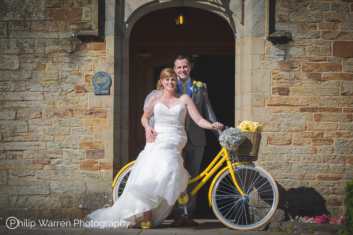 bride and groom on bicycle