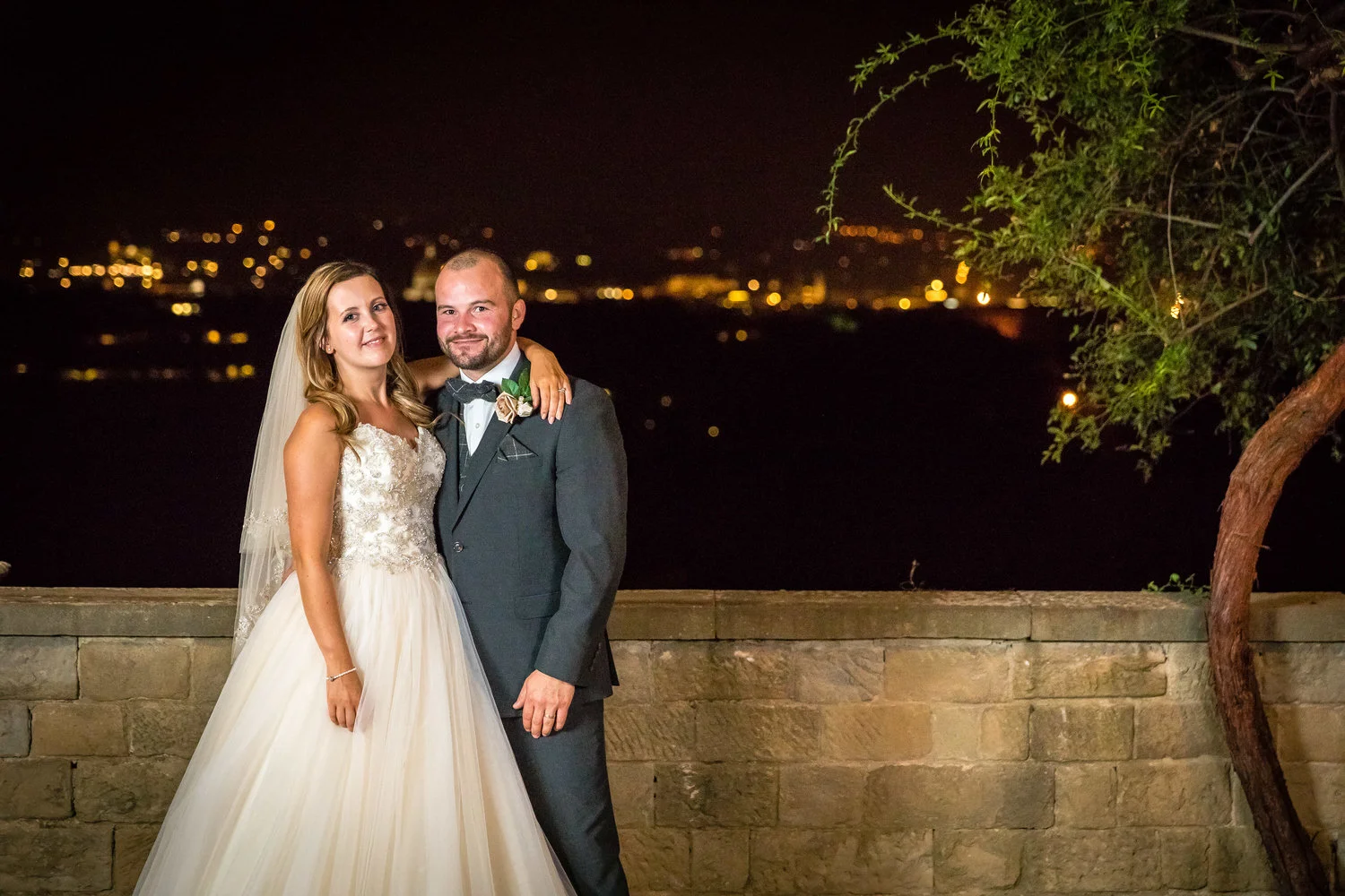 photos of bride and groom at night with florence in the backgrou