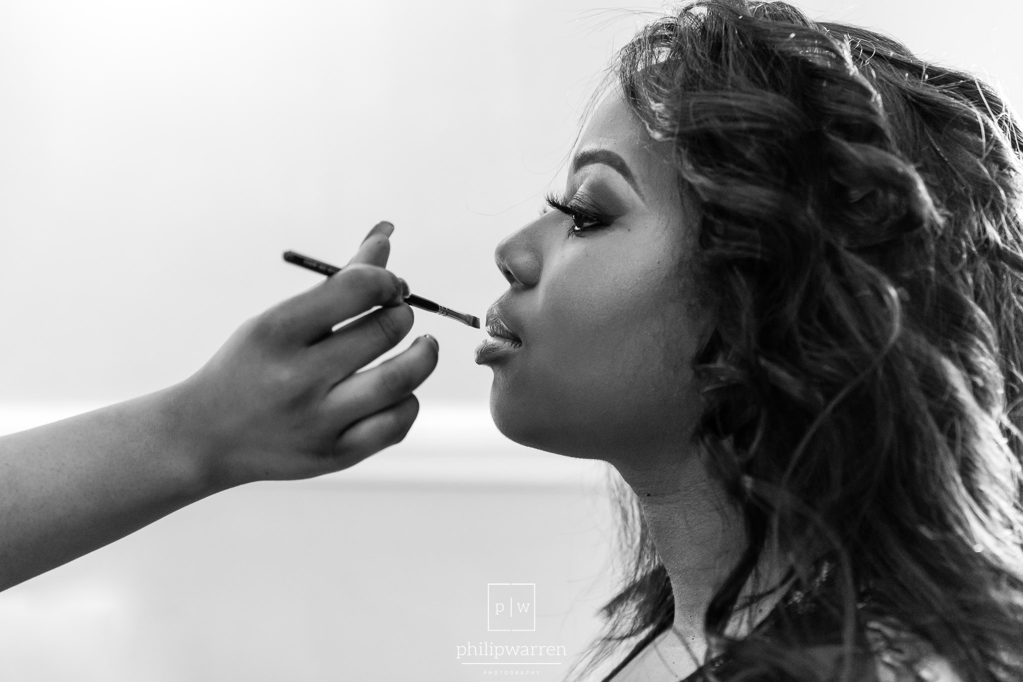 bride having makeup applied in bryngarw house