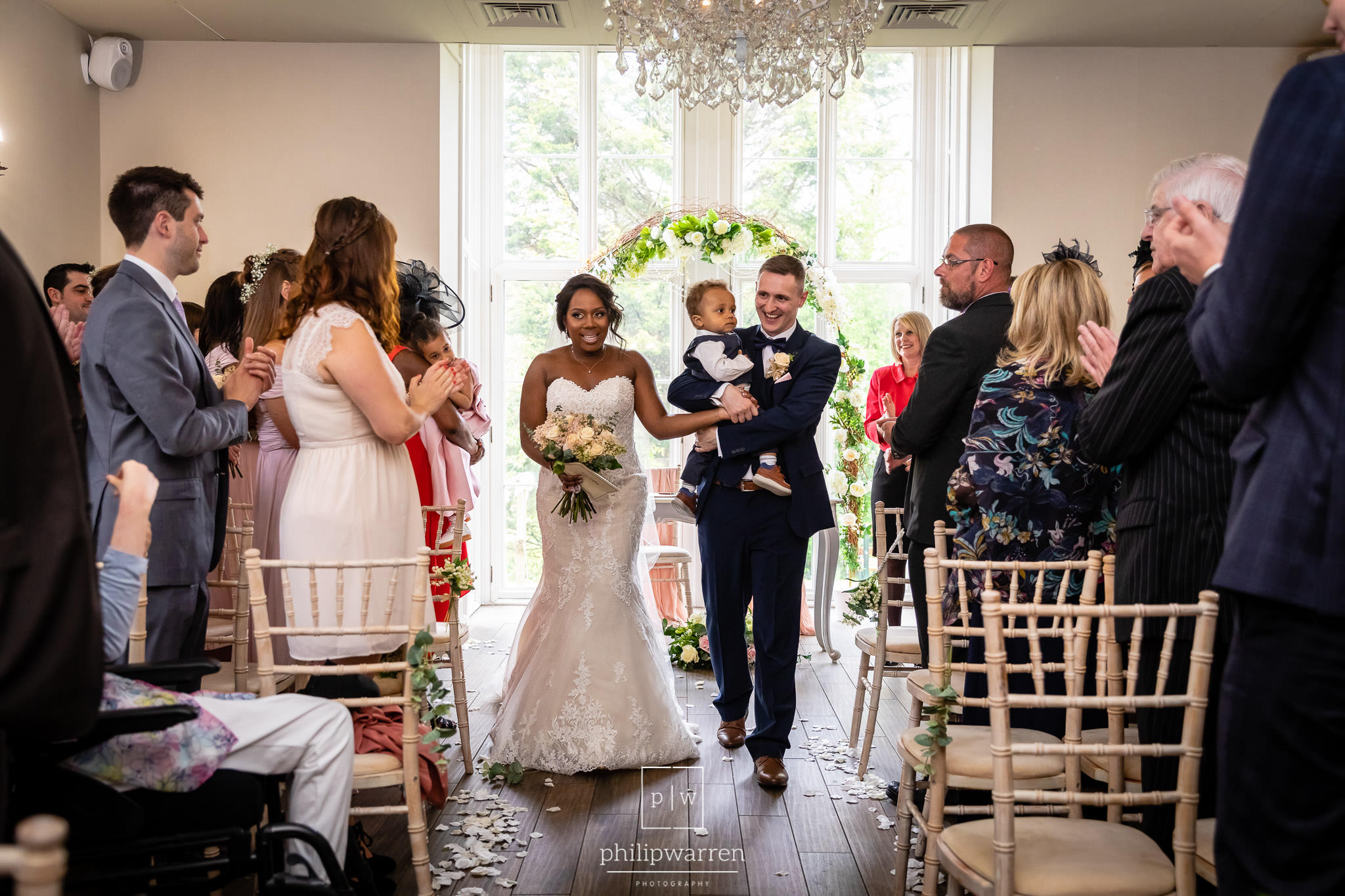 bride and groom walking up the aisle after the wedding ceremony