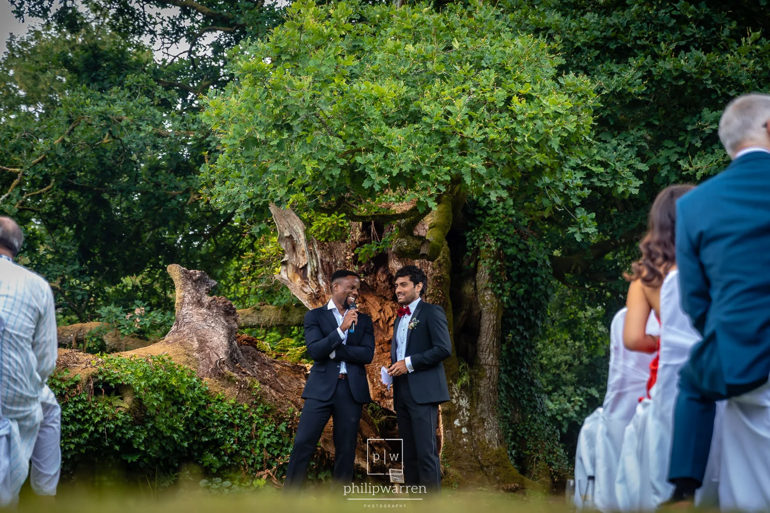 groom and best man smiling before wedding ceremony