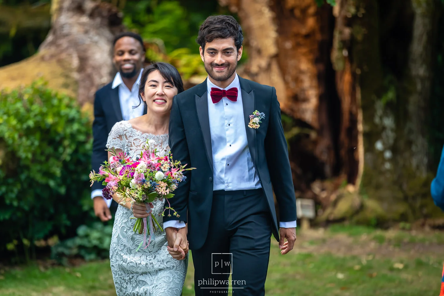 just married walking down the aisle outdoors at plas glansevin