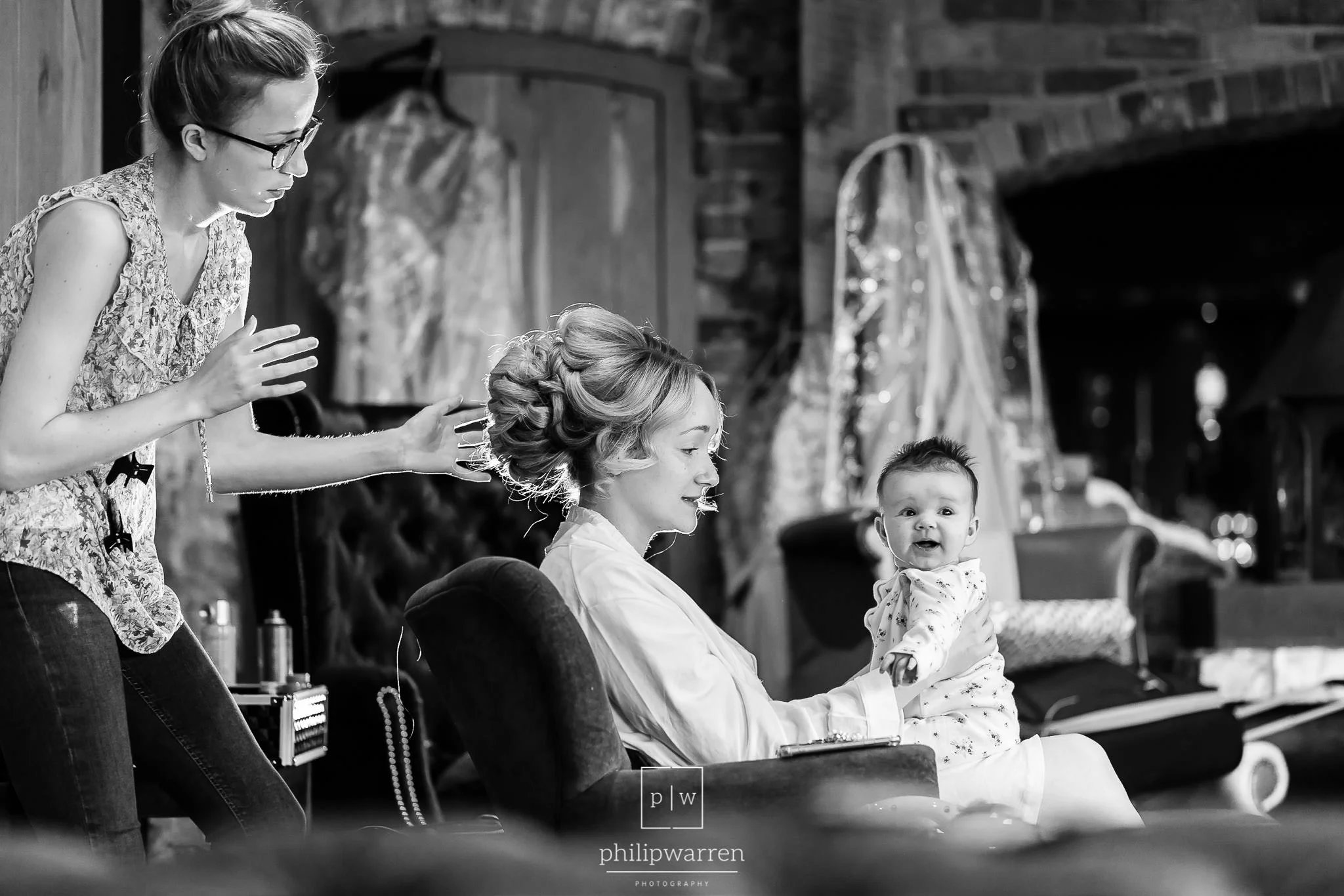 bride and her baby daughter getting ready for the wedding
