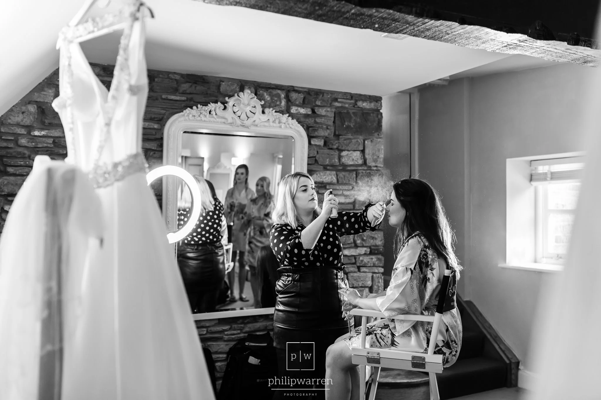 bride having wedding make up before wedding