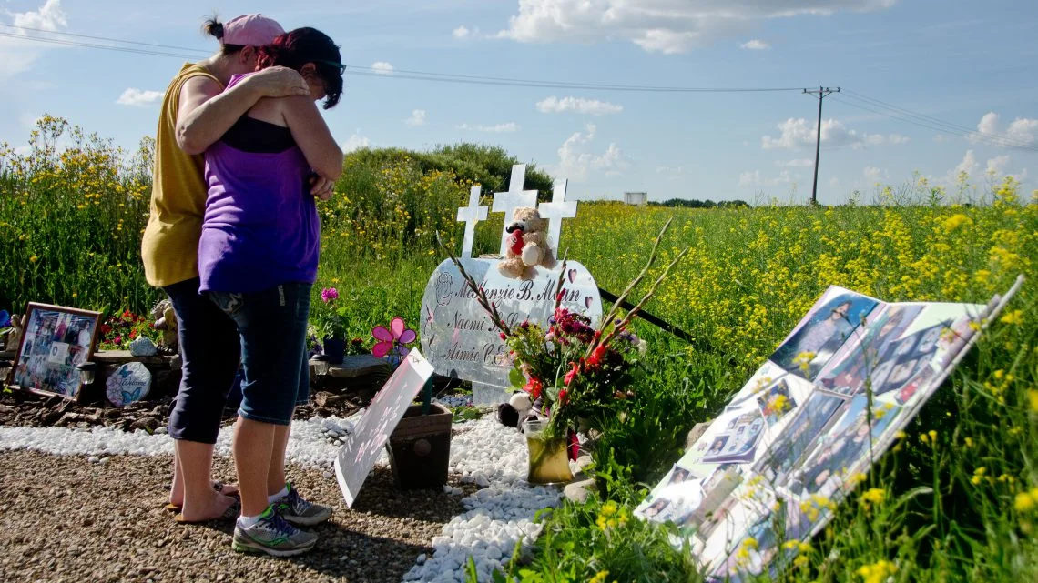 Donna Hurley is comforted by her sister, Betty Badcock, while standing at a memorial for Aimee Hurley. Aimee was one of six teens who lost their lives in a car accident near Lloydminster on July 27, 2013. Photo by James Wood/106.1 The Goat/Vista Radio