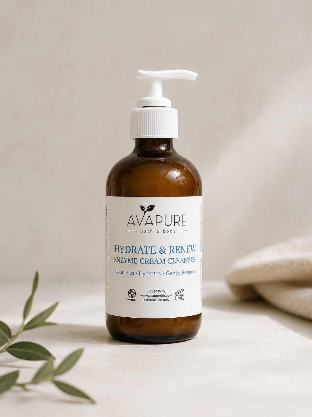 Avapure Hydrate + Renew Enzyme Cream Cleanser in an amber glass bottle for gentle cleansing, hydration, and brighter-looking skin.