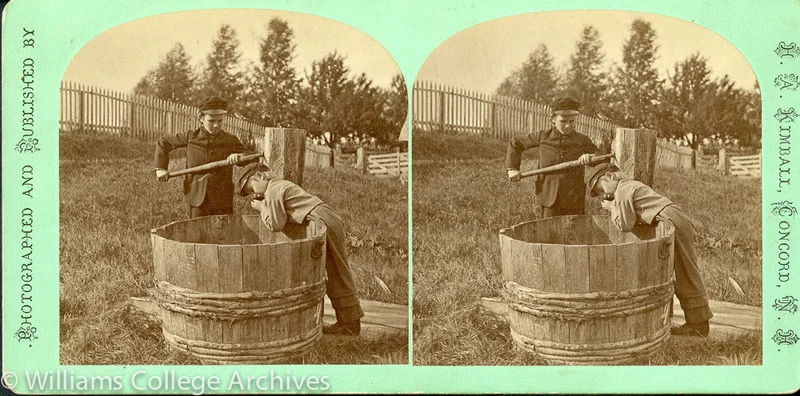 Two Shaker boys drawing water from a well