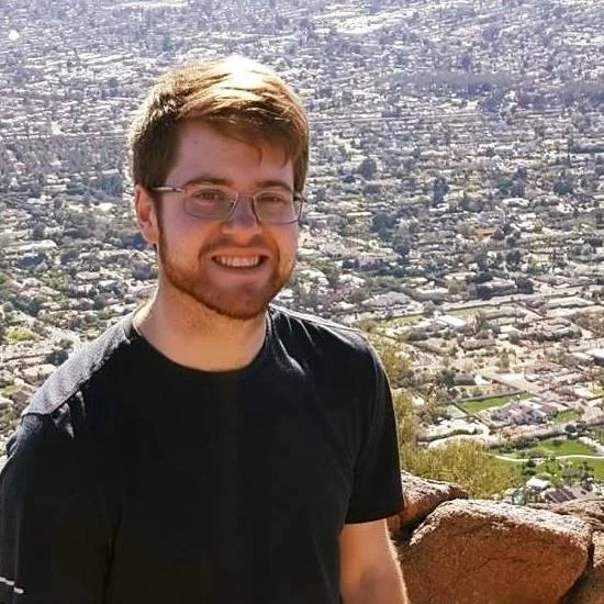 Lucas Nielsen is a senior in the Film/Video program at Grand Valley State University, looking to graduate in 2018. He writes scripts for fiction shows on GVSU's student-run TV station and is currently writing several features, one of which is in the process of pre-production for filming summer 2018. On the 2017 GVSU summer film project, he was the on-set editor. When not writing, editing, or producing his own projects, Lucas enjoys hiking (see photo). He hopes to write for television in the future.