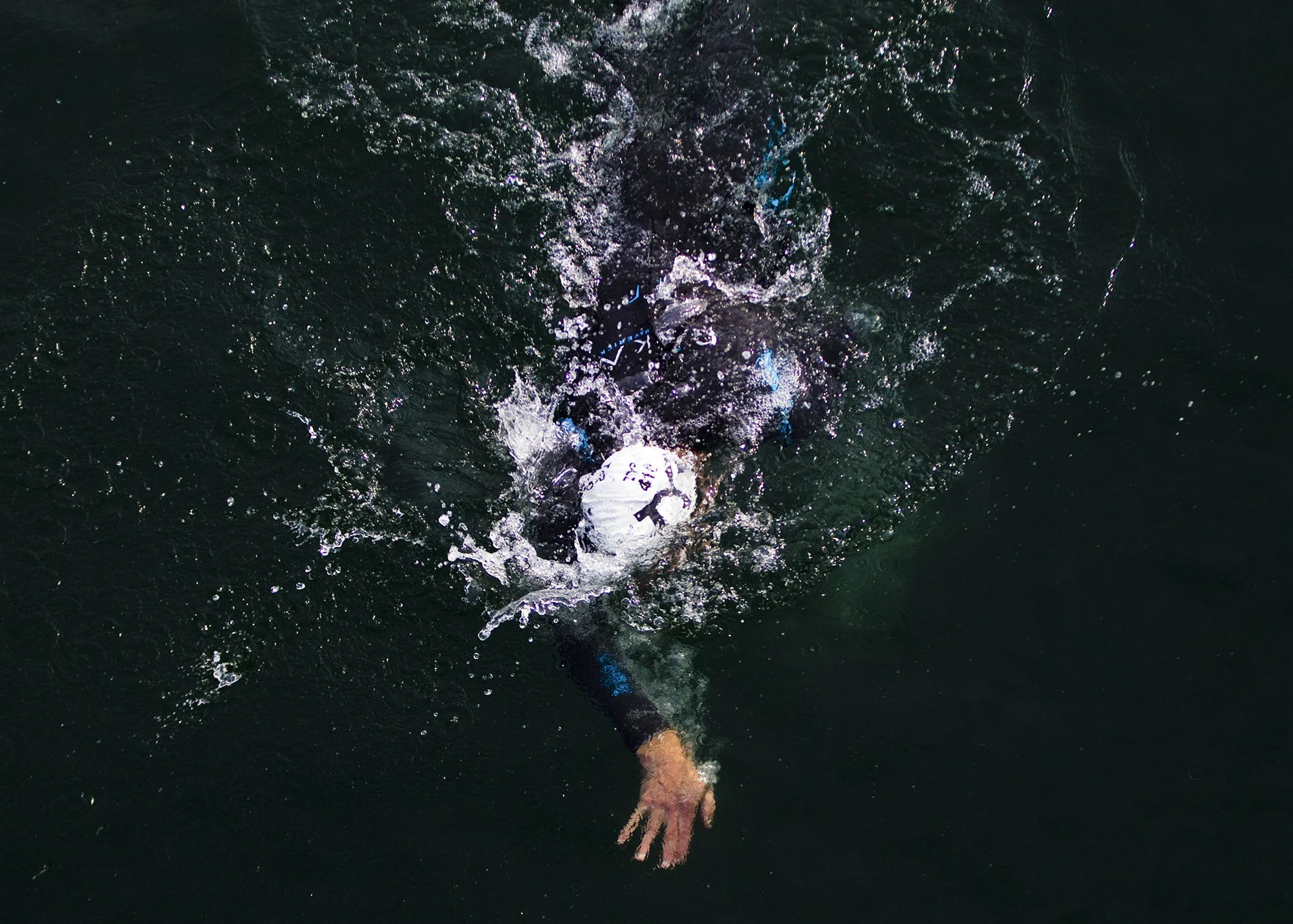 Triathletes swim on the first leg of the race during the Olympic-Distance National Championships on Saturday, August 8, 2015 at the Lakefront in downtown Milwaukee.